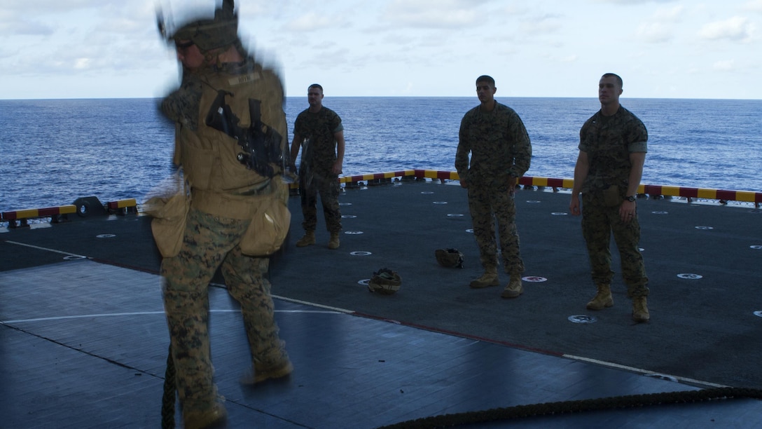 A Marine with Company E, Battalion Landing Team, 2nd Battalion, 4th Marines, fast-ropes toward an aircraft elevator during training at sea aboard the USS Bonhomme Richard, Sept. 3, 2016. Marines with BLT 2/4 are currently embarked aboard the BHR during a regularly scheduled patrol of the Asia-Pacific region. The 31st MEU is the Marine Corps’ only continuously forward-deployed Marine Air-Ground Task Force, and combines air-ground-logistics into a single team capable of addressing a range of military operations in the Asia-Pacific region – from force projection and maritime security to humanitarian assistance and disaster relief in cooperation with host countries and partner militaries.