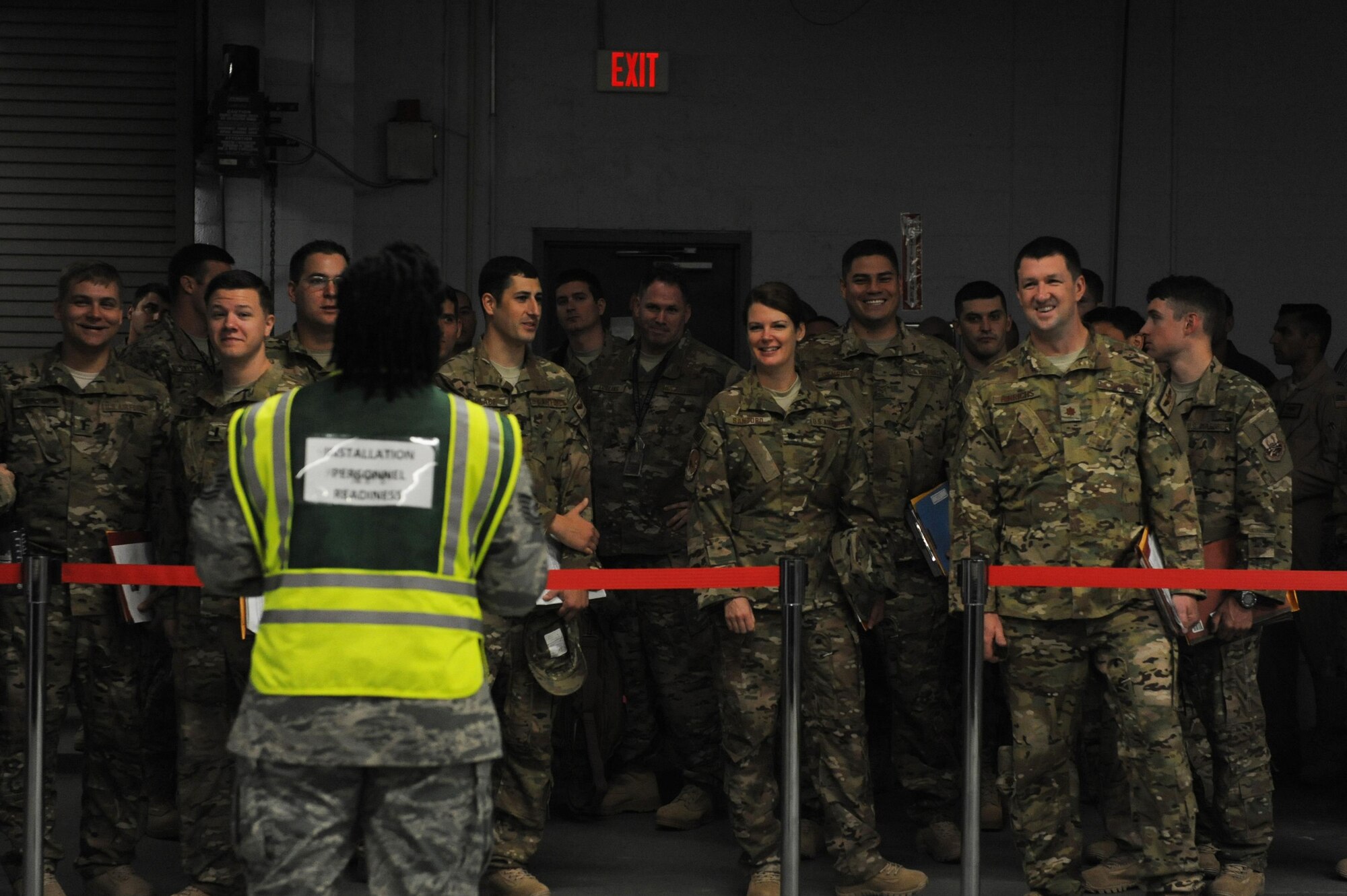 U.S. Air Force Airmen from the 41st Airlift Squadron and 19th Logistics Readiness Squadron are briefed prior to processing through a personnel deployment function line Sept. 1, 2016, at Little Rock Air Force Base, Ark. A PDF line is conducted to review required documents prior to departure. (U.S. Air Force photo by Senior Airman Mercedes Taylor) 