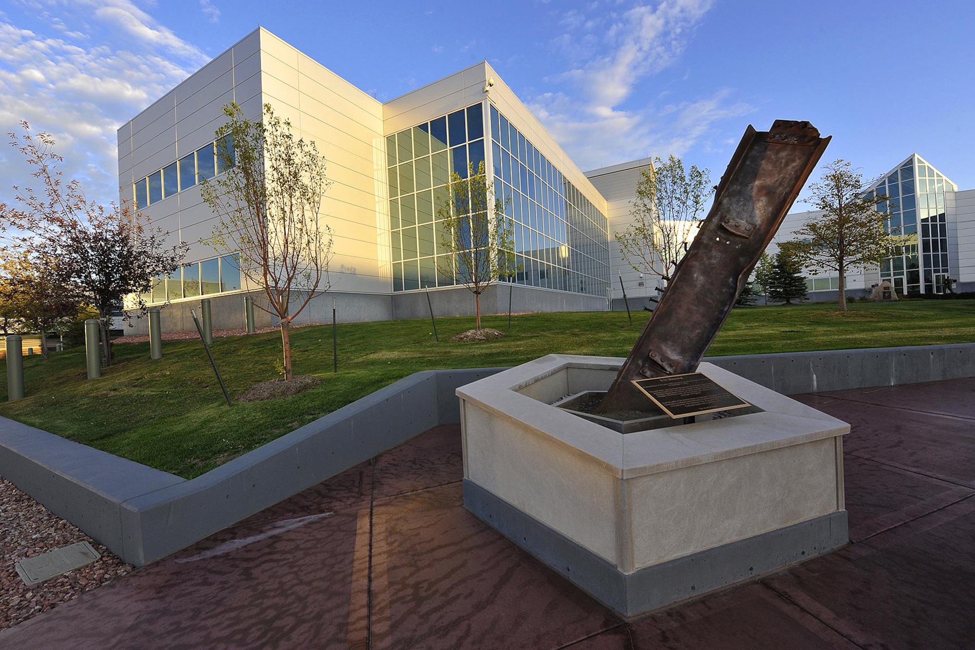 PETERSON AIR FORCE BASE, Colo. – A 9/11 memorial was placed outside North American Aerospace Defense Command and U.S. Northern Command Headquarters at Peterson Air Force Base, Colo., May 18, 2010. The memorial incorporates a pentagon-shaped basin filled with soil from Shanksville, Pennsylvania, and the beam is oriented toward New York City. (U.S. Air Force photo by Rob Bussard)