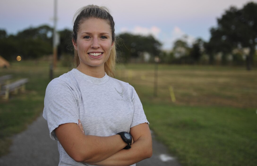 Senior Airman Rebecca Chamberlain, a paralegal with the 1st Special Operations Wing Legal Office, stands on a track at Hurlburt Field, Fla., Aug. 30, 2016. Chamberlain is scheduled to participate in the half-marathon during the 20th Annual Air Force Marathon, Sept. 17, at Wright-Patterson Air Force Base, Ohio, as a member of the Air Force Special Operations Command’s team. (U.S. Air Force photo by Airman 1st Class Joseph Pick)
