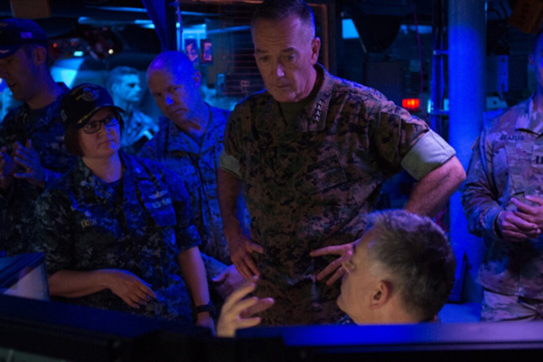 Marine Corps Gen. Joe Dunford, chairman of the Joint Chiefs of Staff, speaks with crew members aboard the Arleigh Burke-class guided missile destroyer USS Barry in Yokosuka, Japan, Sept. 7, 2016. DoD photo by Army Sgt. James K. McCann