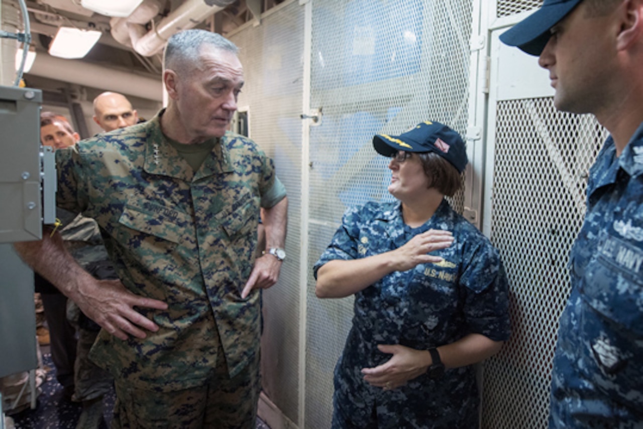 Navy Cmdr. Jennifer Eaton, commanding officer of the USS Barry, an Arleigh Burke-class guided missile destroyer, introduces Marine Corps Gen. Joe Dunford, chairman of the Joint Chiefs of Staff, to a crew member during a visit aboard the ship in Yokosuka, Japan, Sept. 7, 2016. DoD photo by Army Sgt. James K. McCann