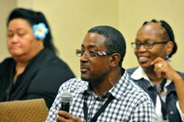 Reginald Howell (center) elicits laughter from his wife Sgt. 1st Class Tracey Howell (right), senior human resources noncommissioned officer, 1st Brigade (Military Intelligence), 100th Training Division Headquarters, Fort Huachuca, Ariz., during a training session at the married couple portion of the 63rd RSC’s latest Strong Bonds event, for both single Soldiers and married couples, Sept. 3, at the Sheraton Hotel, San Diego. Strong Bonds uses teaching techniques that utilize an Army approved curriculum and is facilitated by Chaplains. (Army Reserve photo by Alun Thomas)