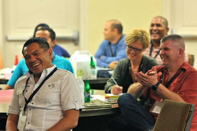 Capt. Edwin Sonoy, from Henderson, Nev. erupts in laughter as his wife Cristina describes how they initially met each other, during the opening introductions at the married couple portion of the 63rd Regional Support Command’s latest Strong Bonds event for both single Soldiers and married couples, Sept. 2, at the Sheraton Hotel, San Diego. Strong Bonds uses teaching techniques that utilize an Army approved curriculum and is facilitated by Chaplains. (Army Reserve photo by Alun Thomas)