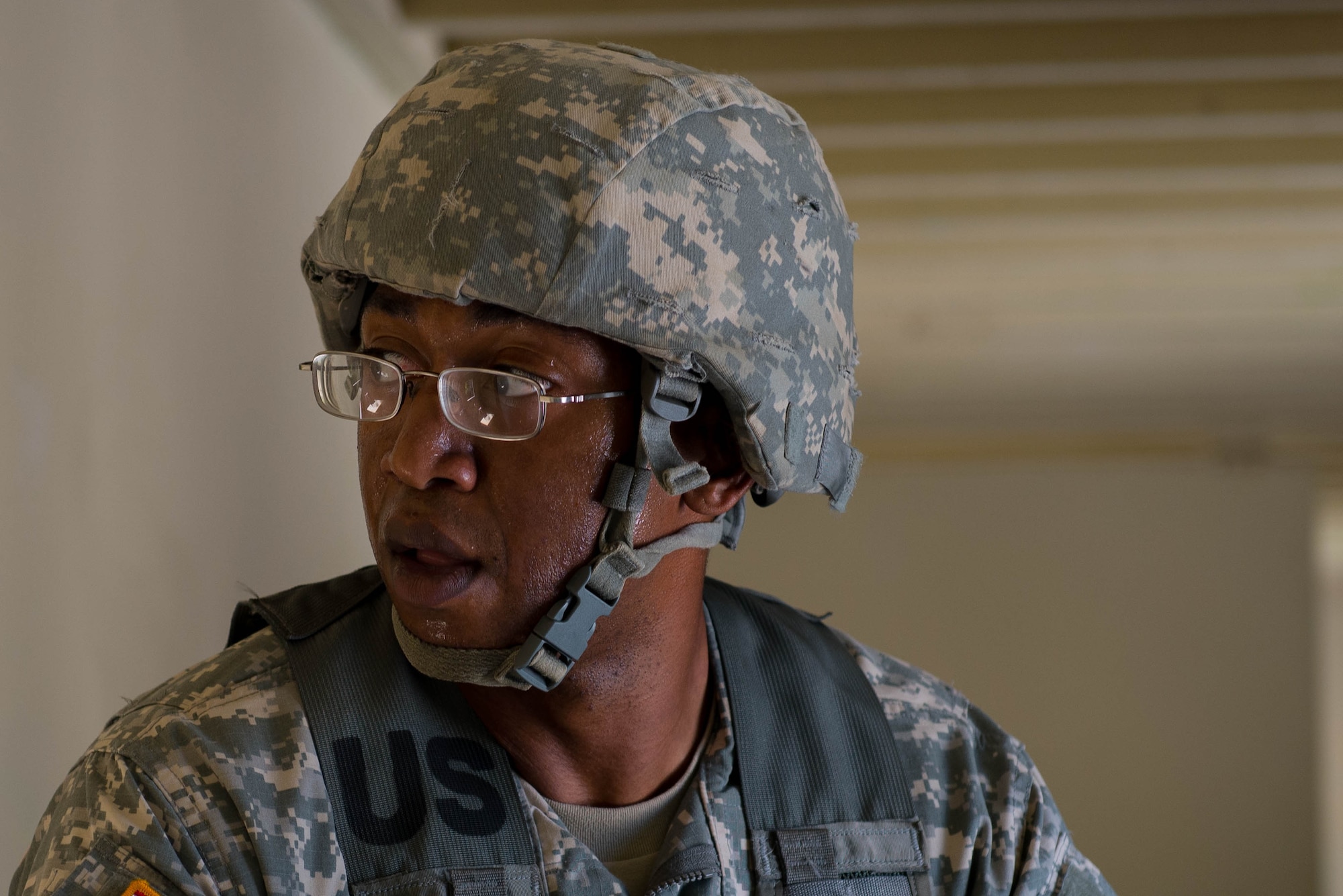 A U.S. Army Soldier attending an Advanced Leadership Course watches for enemies as his squad leaves a building during an exercise at Fort Eustis, Va., Aug. 29, 2016. Each Soldier had the opportunity to conduct a block of training, and perform squad leader duties during the field training exercise. (U.S. Air Force photo by Airman 1st Class Derek Seifert)