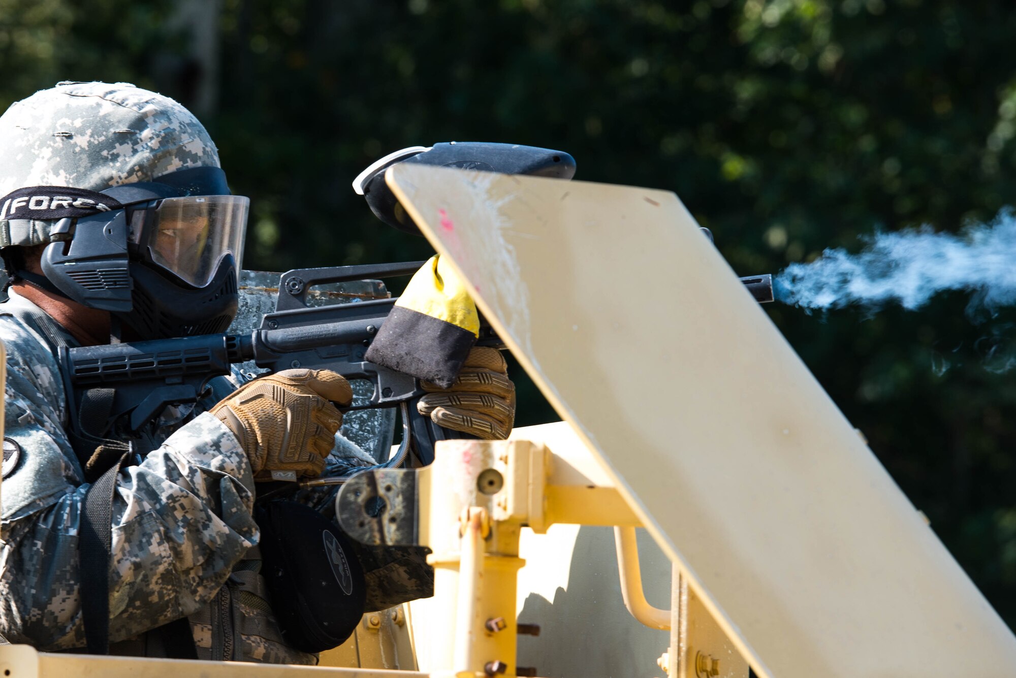 A U.S. Army Soldier attending an Advanced Leadership Course returns simulated fire on enemies during the field training exercise at Fort Eustis, Va., Sept. 1, 2016. The class used paintball equipment in the final exercise to make the ambushes and firefights more realistic. (U.S. Air Force photo by Airman 1st Class Derek Seifert)