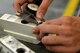 U.S. Air Force Airman 1st Class Justin Romaca, 20th Equipment Maintenance Squadron metals technology apprentice, uses a dial caliber to measure the distances between corresponding ends of an F-16CM Fighting Falcon flap mount at Shaw Air Force Base, S.C., Sept. 7, 2016. The dial caliber is utilized to conduct precise measurements of the flaps before any milling or reaming begins. (U.S. Air Force photo by Airman 1st Class Christopher Maldonado) 