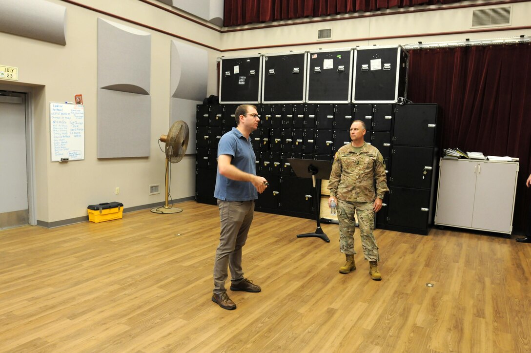 Jordan Lynch, left, unit administrator for the 338th Army Band, shows Maj. Gen. Patrick Reinert, commanding general of 88th Regional Support Command, the practice hall during a tour of the unit’s facilities Aug. 29.