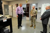 David Graham, left, a heavy mobile equipment repair supervisor for Area Maintenance Support Activity (AMSA) 56, shows Maj. Gen. Patrick Reinert, commanding general of 88th Regional Support Command, and David Fyfe, director of logistics, 88th RSC, a new vehicle diagnostic machine at the Whitehall, Ohio, facility Aug. 29.