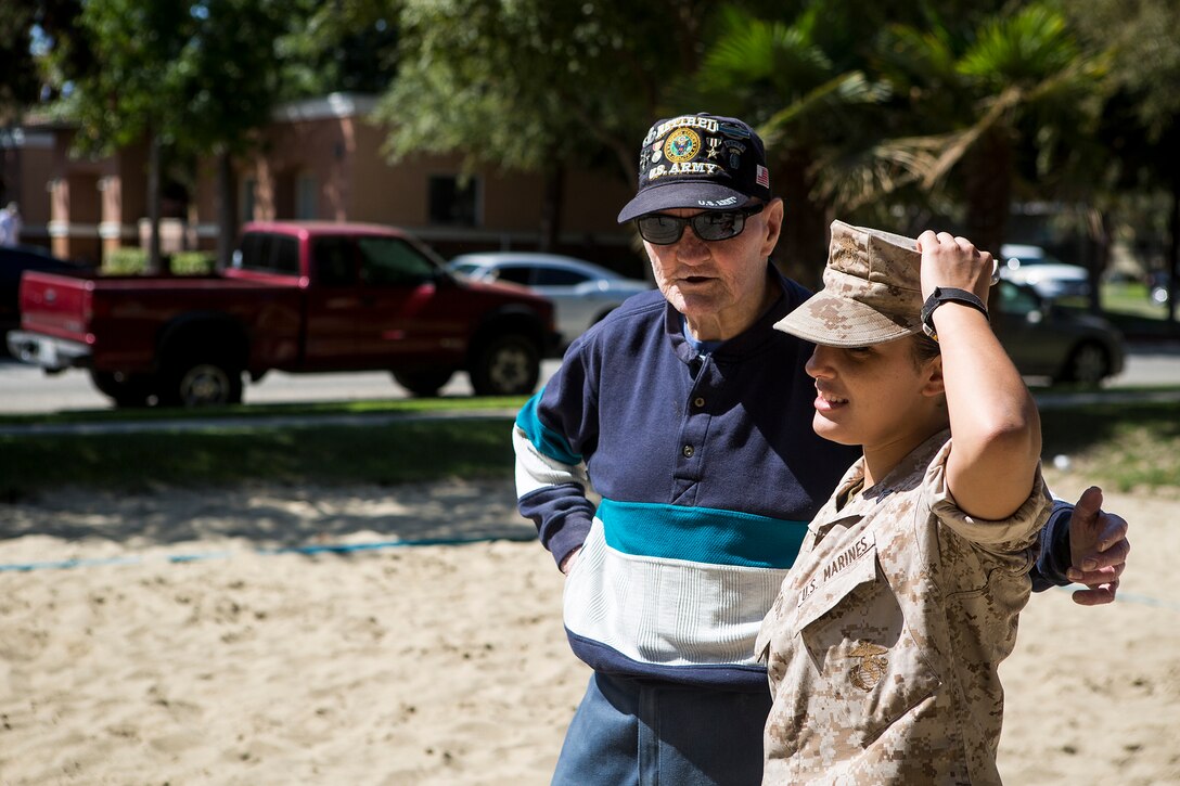 U.S. Marine Sgt. Julia Langford, right, an aviation electronics technician with Marine Light Attack Helicopter Squadron 369, speaks to a veteran of the U.S. armed forces during a community service project for the United States Veterans Initiative, a nonprofit organization that helps homeless veterans, Sept. 2, 2016, in Long Beach, Calif. Marines, Sailors and Coast Guardsmen, visited the facility where hundreds of homeless veterans live and receive assistance and care. The visit was one of many community service projects that took place during the first Los Angeles Fleet Week. (U.S. Marine Corps photo by Sgt. Rick Hurtado)