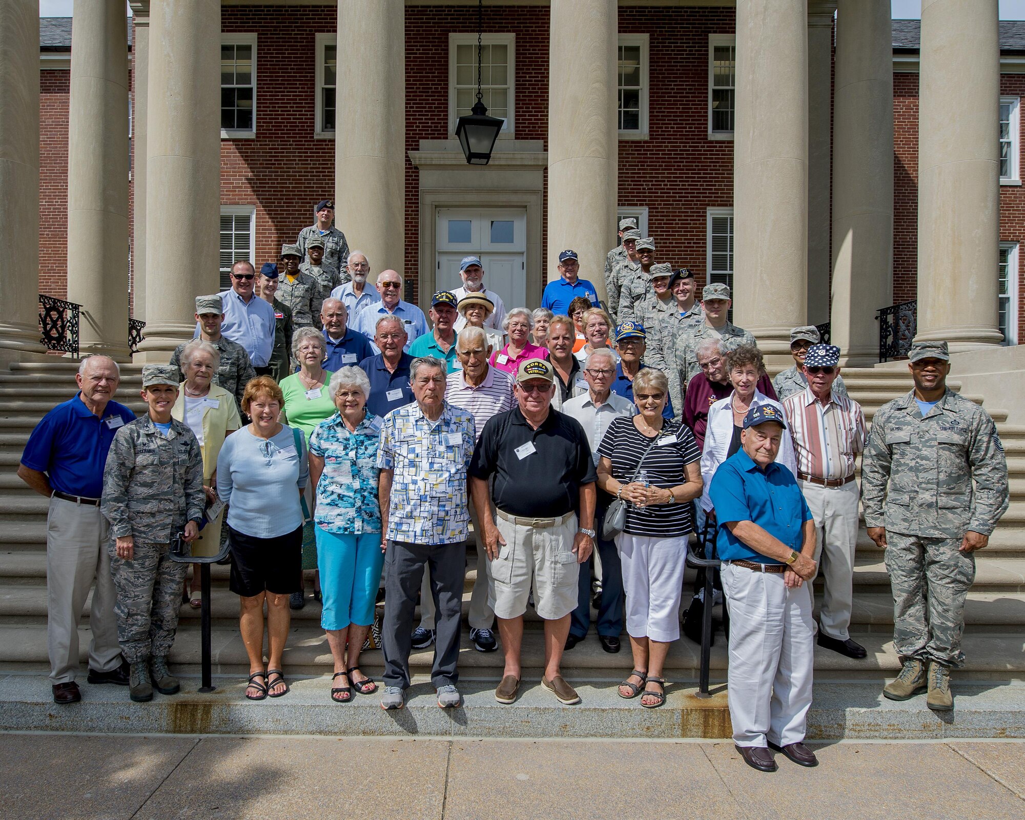 Korean War veterans of the 6147th Mosquitos met with Col. Laura Lenderman, 375th Air Mobility Wing Commander, and Scott Air Force Base Airmen to share their military experiences, Aug. 26, 2016, Scott AFB, Illinois. The Korean War Mosquitos visited Scott to learn about the present day Air Force and the installation, and the members shared their many stories about their jobs and missions as radio operators and pilots during the Korean War. (U.S. Air Force photo by Senior Airman Joshua Eikren)