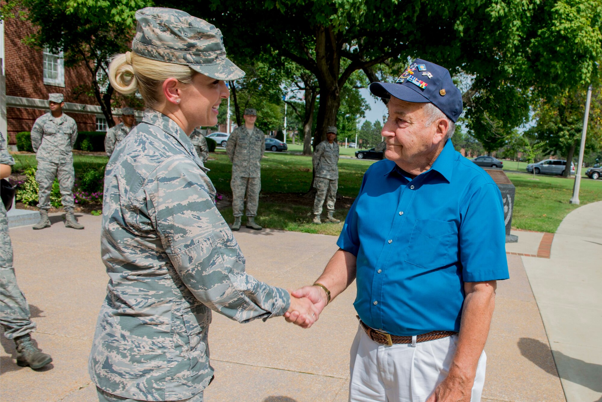 Korean War veterans of the 6147th Mosquitos met with Col. Laura Lenderman, 375th Air Mobility Wing Commander, and Scott Air Force Base Airmen to share their military experiences, Aug. 26, 2016, Scott AFB, Illinois. The Korean War Mosquitos visited Scott to learn about the present day Air Force and the installation, and the members shared their many stories about their jobs and missions as radio operators and pilots during the Korean War. (U.S. Air Force photo by Senior Airman Joshua Eikren)