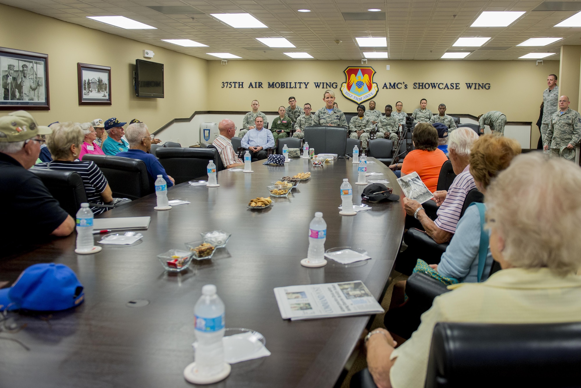 Korean War veterans of the 6147th Mosquitos met with Col. Laura Lenderman, 375th Air Mobility Wing Commander, and Scott Air Force Base Airmen to share their military experiences, Aug. 26, 2016, Scott AFB, Illinois. The Korean War Mosquitos visited Scott to learn about the present day Air Force and the installation, and the members shared their many stories about their jobs and missions as radio operators and pilots during the Korean War. (U.S. Air Force photo by Senior Airman Joshua Eikren)