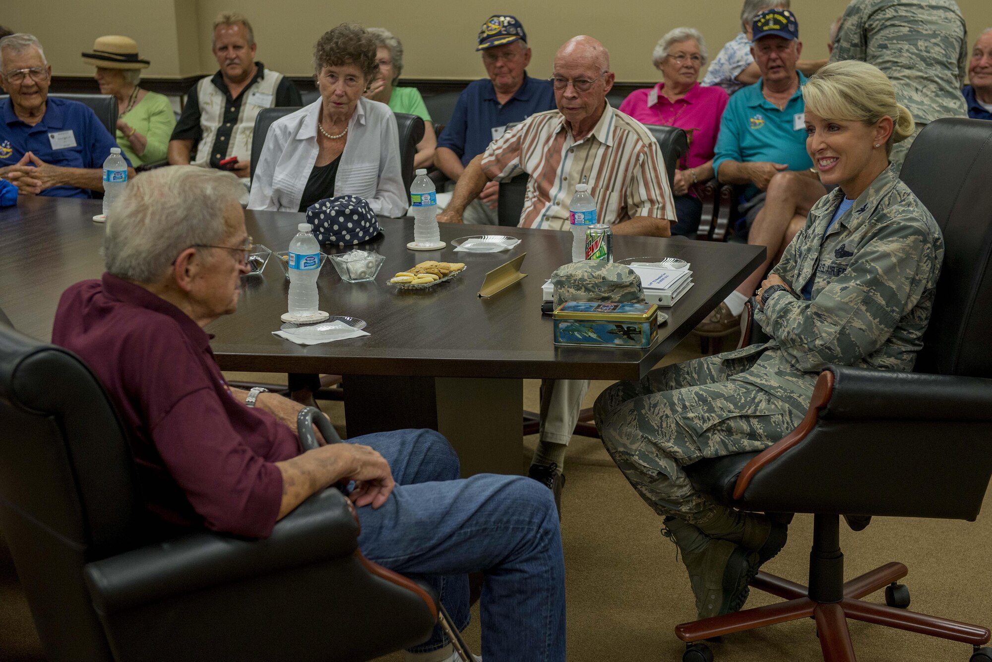 Korean War veterans of the 6147th Mosquitos met with Col. Laura Lenderman, 375th Air Mobility Wing Commander, and Scott Air Force Base Airmen to share their military experiences, Aug. 26, 2016, Scott AFB, Illinois. The Korean War Mosquitos visited Scott to learn about the present day Air Force and the installation, and the members shared their many stories about their jobs and missions as radio operators and pilots during the Korean War. (U.S. Air Force photo by Senior Airman Joshua Eikren)
