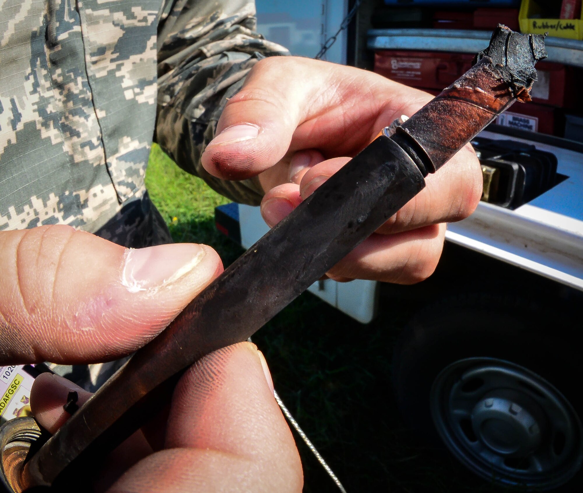 Staff Sgt. Scott Baxley, 2nd Civil Engineer Squadron electrical systems craftsman, examines an old fuse to see if it needs to be replaced at Barksdale Air Force Base, La., Aug. 31, 2016. Electrical Airmen not only repair electrical equipment, but are also responsible for restoring power to the base during an outage. (U.S. Air Force photo/Senior Airman Luke Hill)