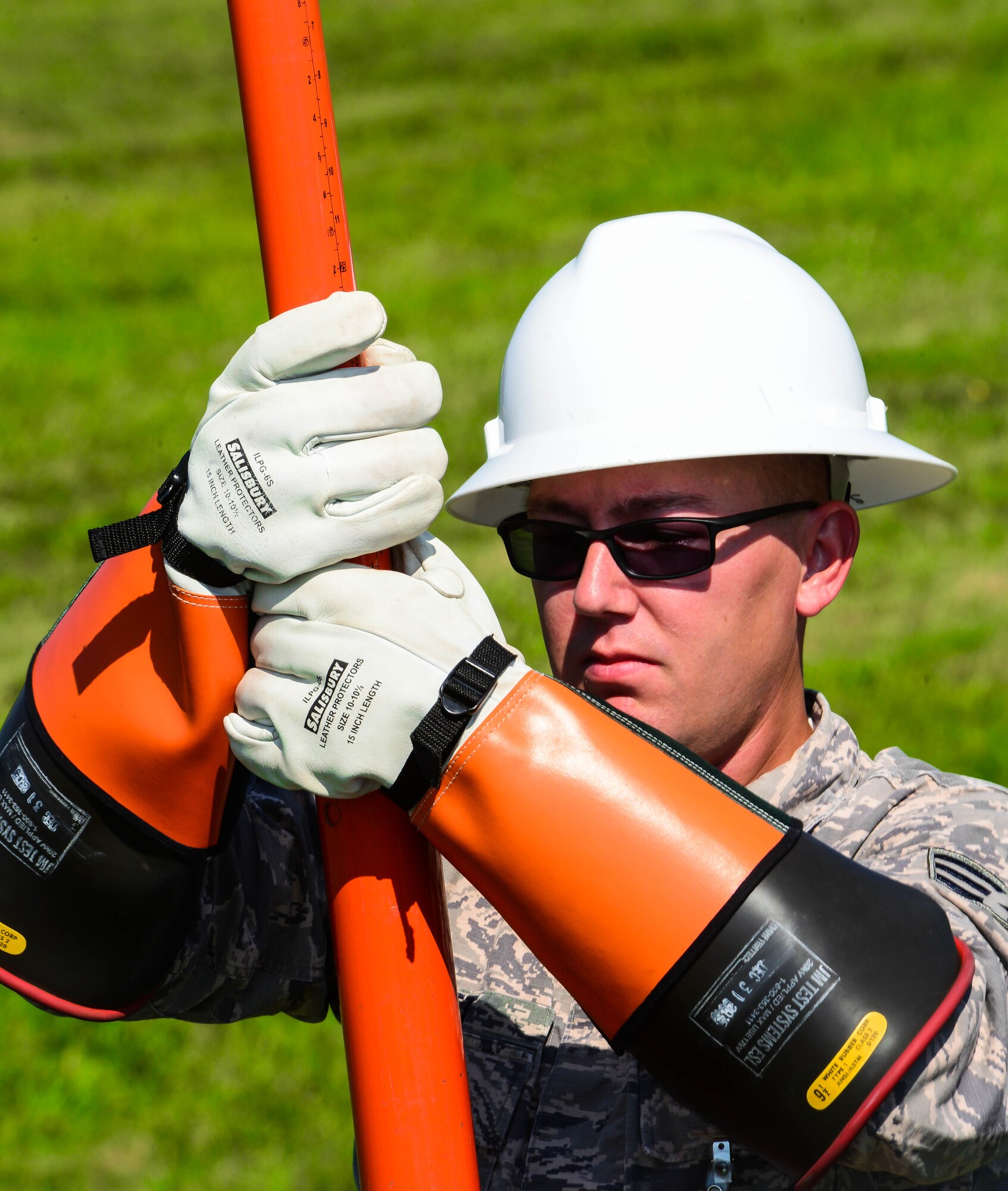 Senior Airman James Scott, 2nd Civil Engineer Squadron electrical systems craftsman, closes down an extension pole after making electrical repairs at Barksdale Air Force Base, La., Aug. 31, 2016. Electrical systems Airmen maintain, troubleshoot and repair all high and low voltage electrical distribution, lightning protection, fire alarm notification and airfield lighting systems for Barksdale. (U.S. Air Force photo/Senior Airman Luke Hill)