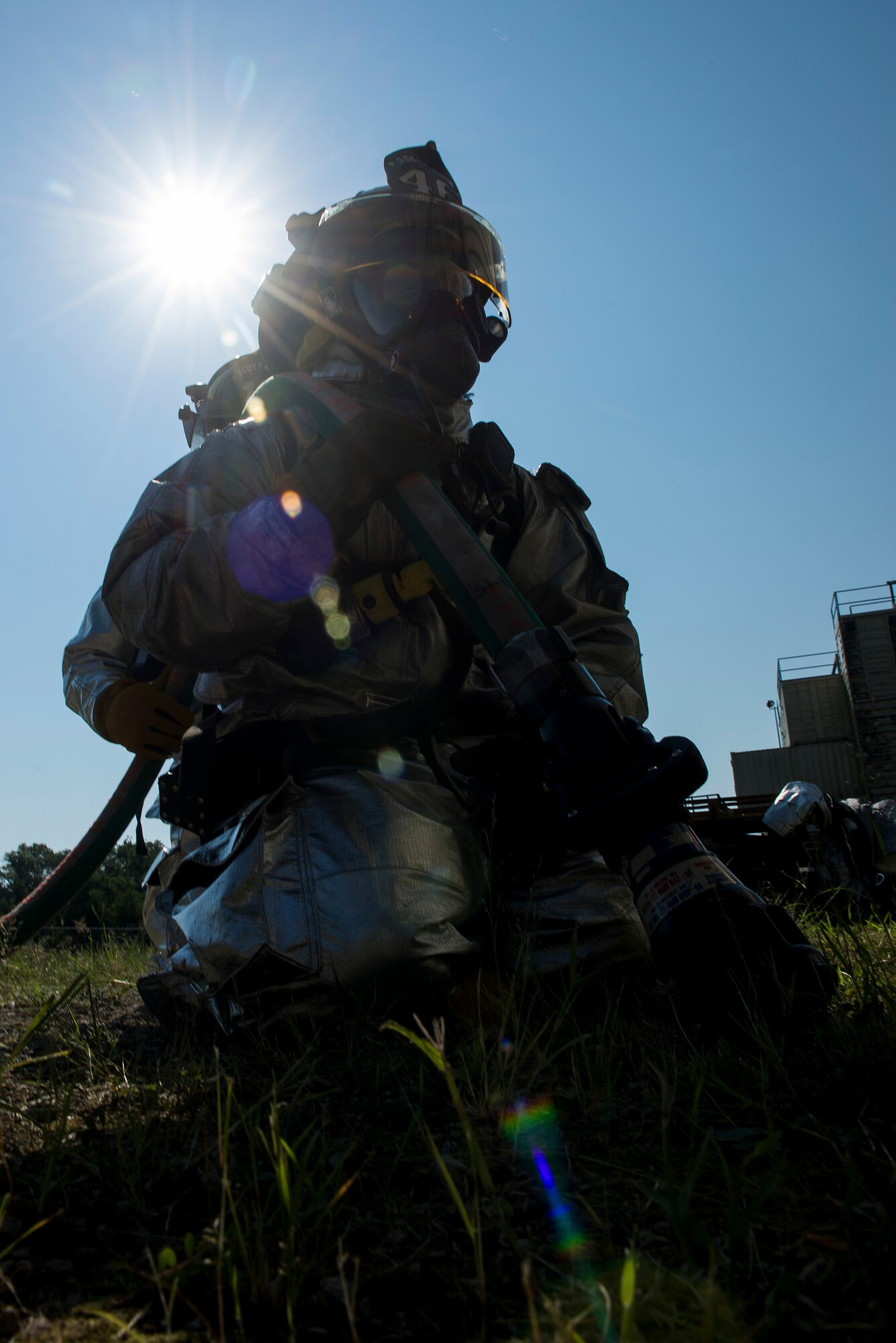 Firefighters with the 375th Civil Engineer Squadron prepare a hose while participating in an instructor credentialing course at Scott Air Force Base, Ill., Aug. 31, 2016. The three-day training program explored the most recent National Fire Protection Association standards and applied principles of the standards to the student’s ability to instruct live fire training in a safe environment. (U.S. Air Force photo/Tech. Sgt. Jonathan Fowler)