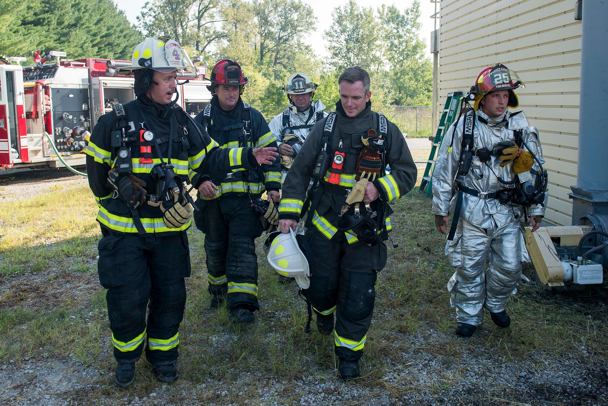 Firefighters from various organizations discuss their upcoming training at Scott Air Force Base, Ill., Aug. 31, 2016. The training featured firefighters from multiple bases and from the local community to include the 628th CES from Joint Base Charleston, South Carolina, the 19th CES from Little Rock AFB, Arkansas, the Mehlville Fire Protection District from St. Louis, Missouri, and the St. Louis Public Schools. (U.S. Air Force photo/Tech. Sgt. Jonathan Fowler)