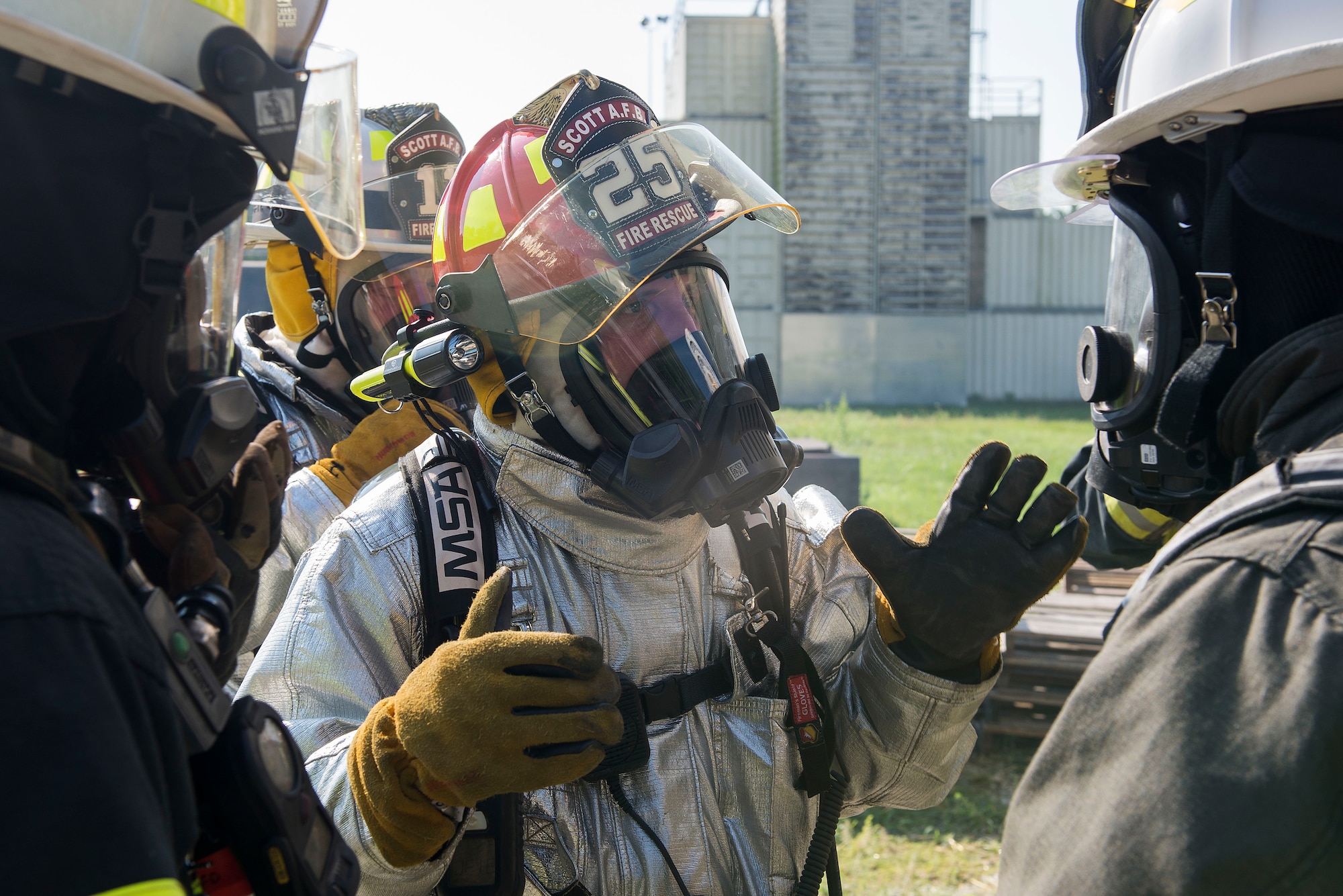 Firefighters discuss tactics and procedures during a training course at Scott Air Force Base, Ill., Aug. 31, 2016. The training featured firefighters from multiple bases and from the local community to include the 628th CES from Joint Base Charleston, South Carolina, the 19th CES from Little Rock AFB, Arkansas, the Mehlville Fire Protection District from St. Louis, Missouri, and the St. Louis Public Schools. (U.S. Air Force photo/Tech. Sgt. Jonathan Fowler)