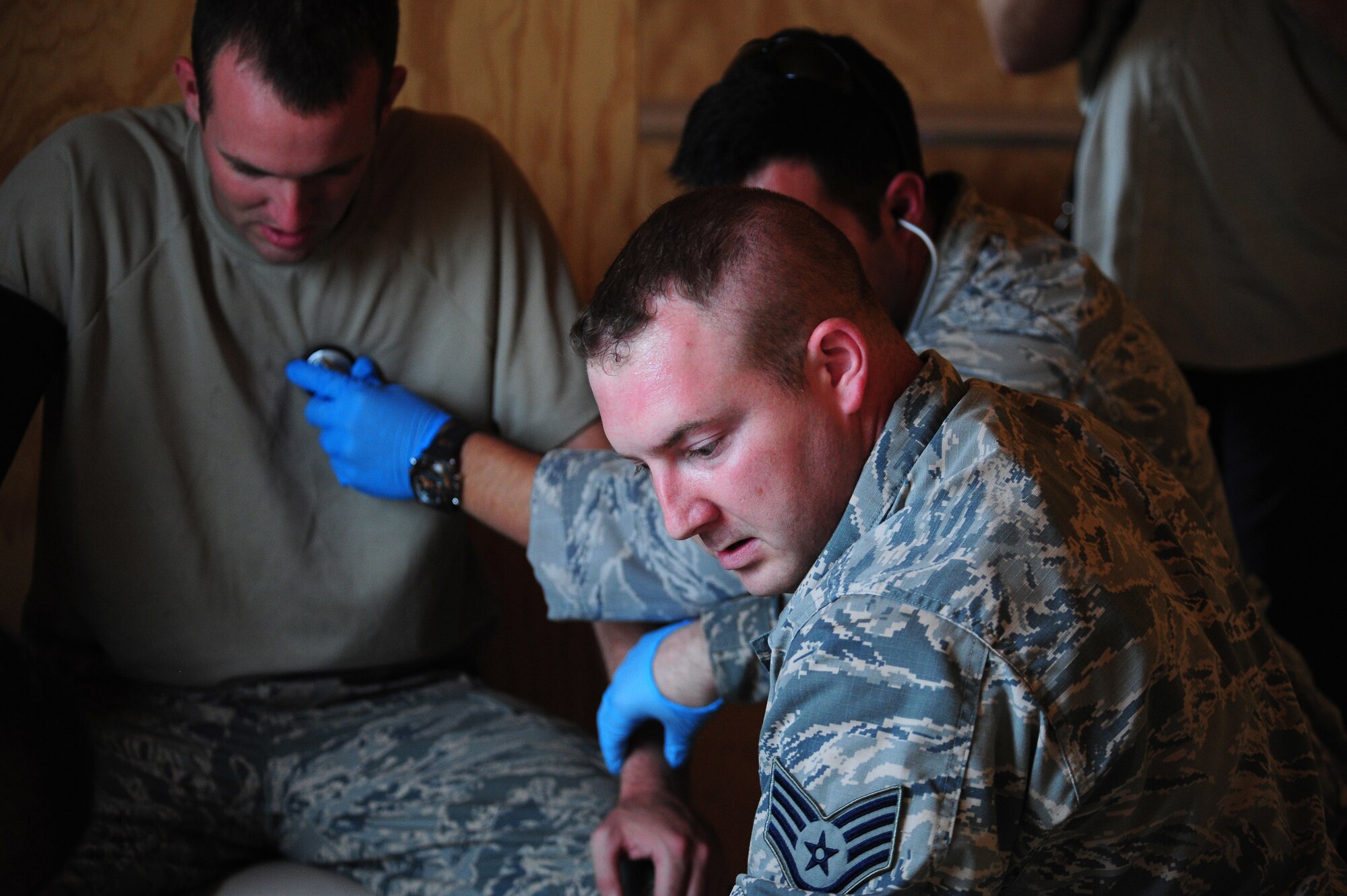 Emergency medical technicians assigned to Scott Air Force Base, Ill., treat a simulated barotrauma patient during exercise scenario casualty during the 2016 EMT Rodeo at Melrose Air Force Range, N.M., Aug. 25, 2016. Cannon’s EMT Rodeo tests the skills of medical professionals from across the Air Force through a series of innovative, high-pressure scenarios. (U.S. Air Force photo by Tech. Sgt. Manuel J. Martinez)