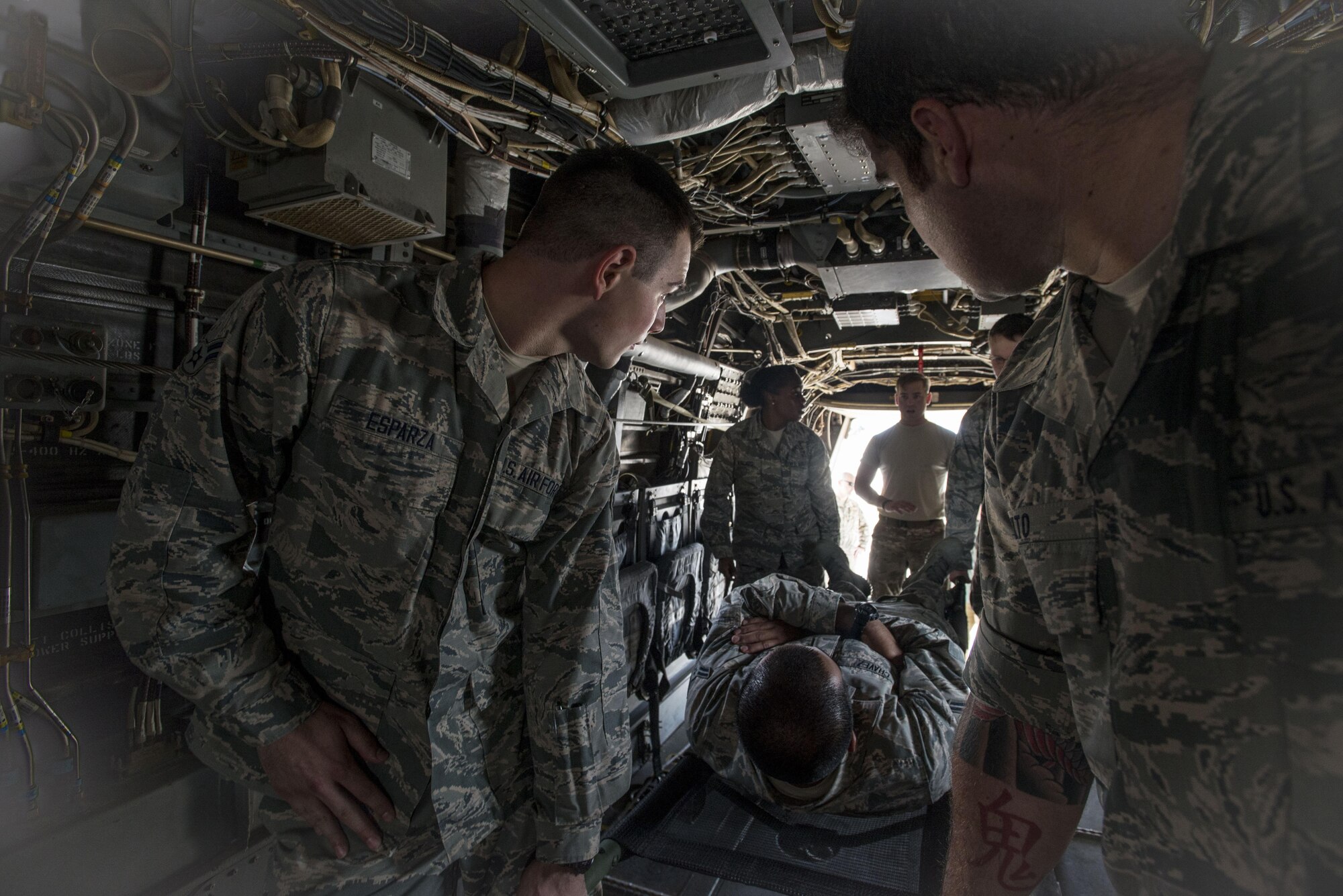 Emergency medical technicians from Scott Air Force Base, IL and Fairchild Air Force Base, Wa., learn the proper procedure for patient loading on a CV-22 Osprey in preparation for the 2016 EMT Rodeo Aug. 24, 2016, at Cannon Air Force Base, N.M. Cannon’s EMT Rodeo tests the skills of medical professionals from across the Air Force through a series of innovative high-pressure scenarios. (U.S. Air Force photo by Staff Sgt. Eboni Reams/Released)