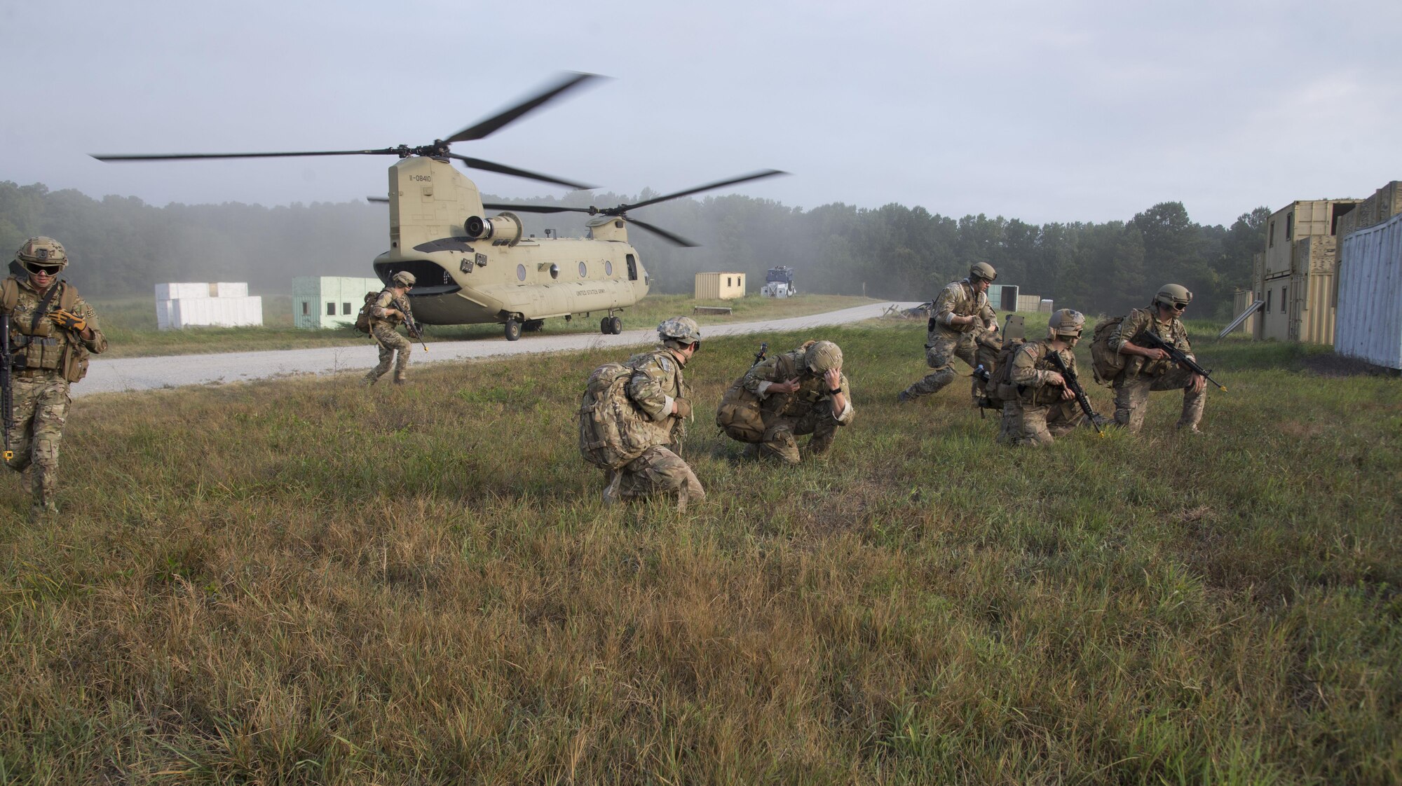 U.S Air Force Airmen assigned to the 633rd Civil Engineer Squadron Explosive Ordinance Disposal team disembark a U.S. Army Chinook helicopter at Fort Pickett, Va., Aug. 31, 2016. The Chinook picked the team up from Langley Air Force Base, Va., then brought them to their training location. (U.S. Air Force photo by Airman First Class Enrique Barcelo)