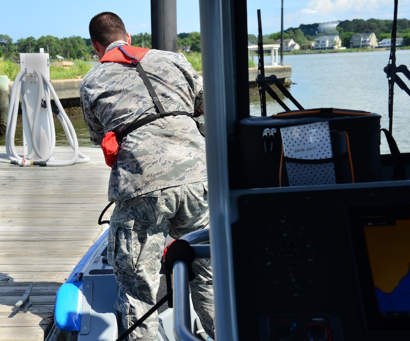 U.S. Air Force Senior Airman Philip Thompson, 633rd Security Forces Squadron boat patrolman, unties the boat before a routine patrol in the Back River, Va., Aug. 17, 2016. The boat patrol, a new addition to the security forces team, performed their first patrol on July 1, 2016. (U.S. Air Force photo by Airman 1st Class Tristan Biese)