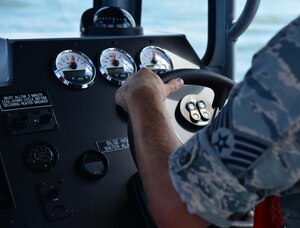 U.S. Air Force Staff Sgt. Shawn McNamara, 633rd Security Forces Squadron boat patrolman, drives the boat during a routine patrol in the Back River, Va., Aug. 17, 2016. The boat patrol unit patrols the water as a physical deterrent to prevent unauthorized access to Langley Air Force Base. (U.S. Air Force photo by Airman 1st Class Tristan Biese)