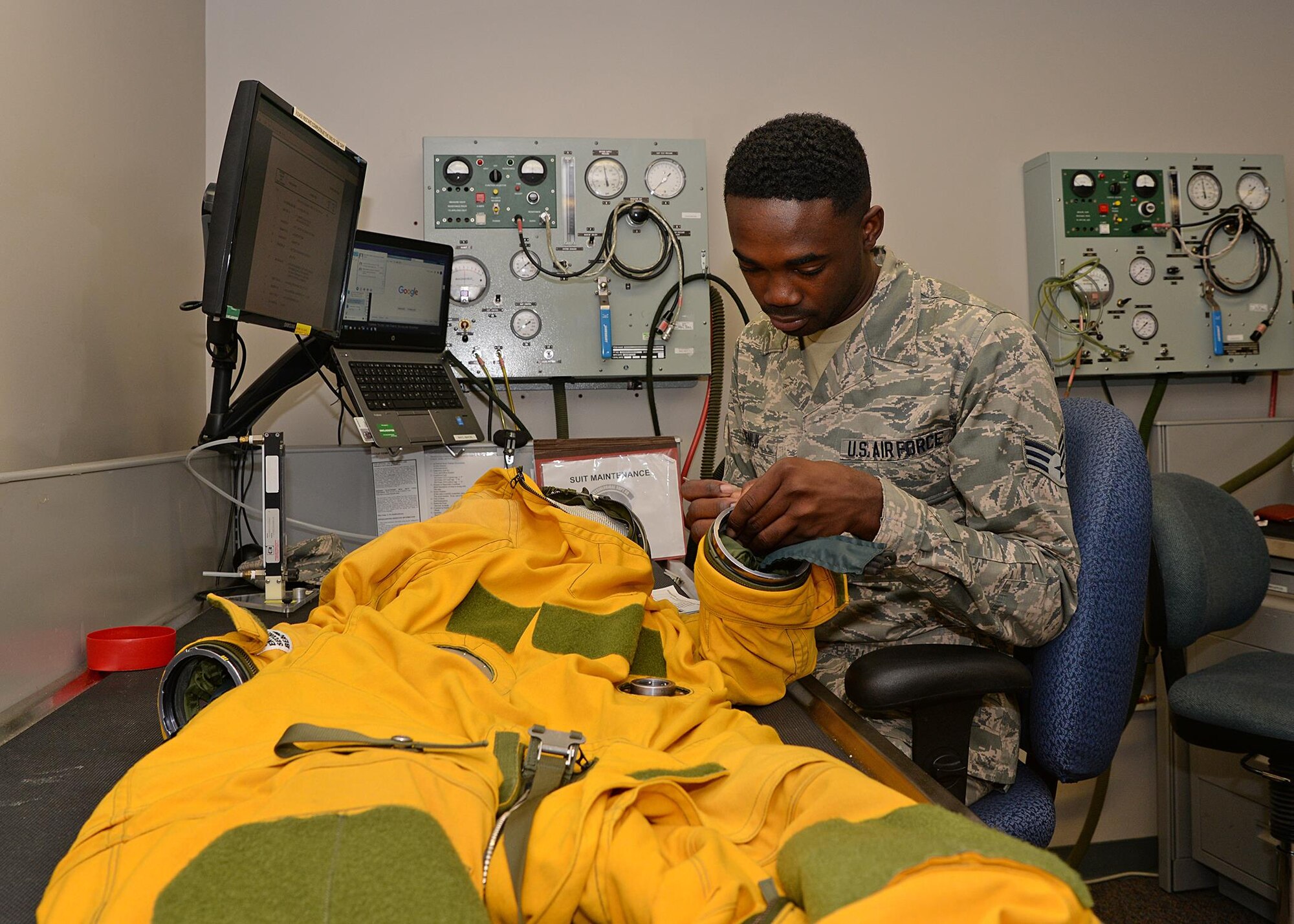 Senior Airman Simon Adeniji, 9th Physiological Support Squadron full pressure suit technician, performs a routine inspection on a full pressure suit Aug. 31, 2016, at Beale Air Force, California. Full pressure suits are worn by U-2 pilots to ensure their safety for flights that can go as high as 70,000 feet. (U.S. Air Force photo/Airman Tristan D. Viglianco)