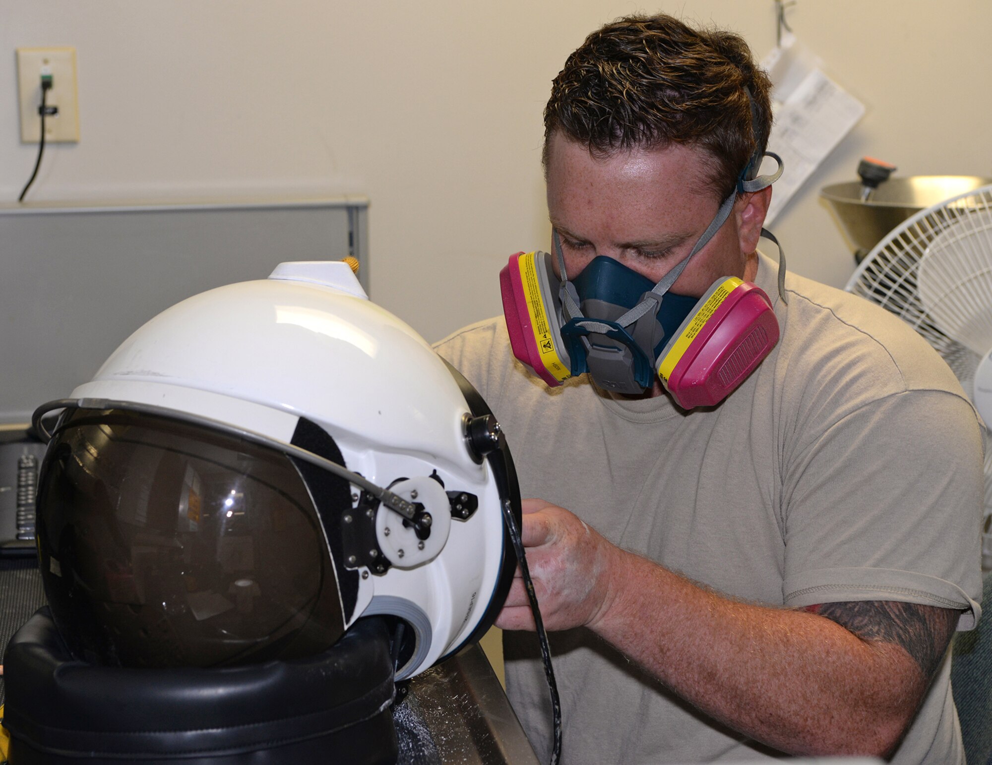 Senior Airman Mason Wyman, 9th Physiological Support Squadron full pressure suit technician, glues a face seal in the helmet Aug. 31, 2016, at Beale Air Force Base, California. The helmet provides the pilot with oxygen and keeps the pressure around the pilot's head stable. (U.S. Air Force photo/Airman Tristan D. Viglianco)
