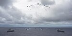 In this file photo, ships and aircraft operate in formation over the Pacific Ocean during exercise Valiant Shield 2014. 
