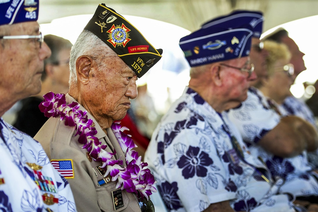 Lucio Sanico, center, a member of the Veterans of Foreign Wars, attends a ceremony marking the 71st anniversary of the end of World War II aboard the Battleship Missouri Memorial in Pearl Harbor, Hawaii, Sept. 2, 2016. The annual event pays tribute to service members who served and sacrificed during the war. Navy photo by Petty Officer 2nd Class Michael H. Lee
