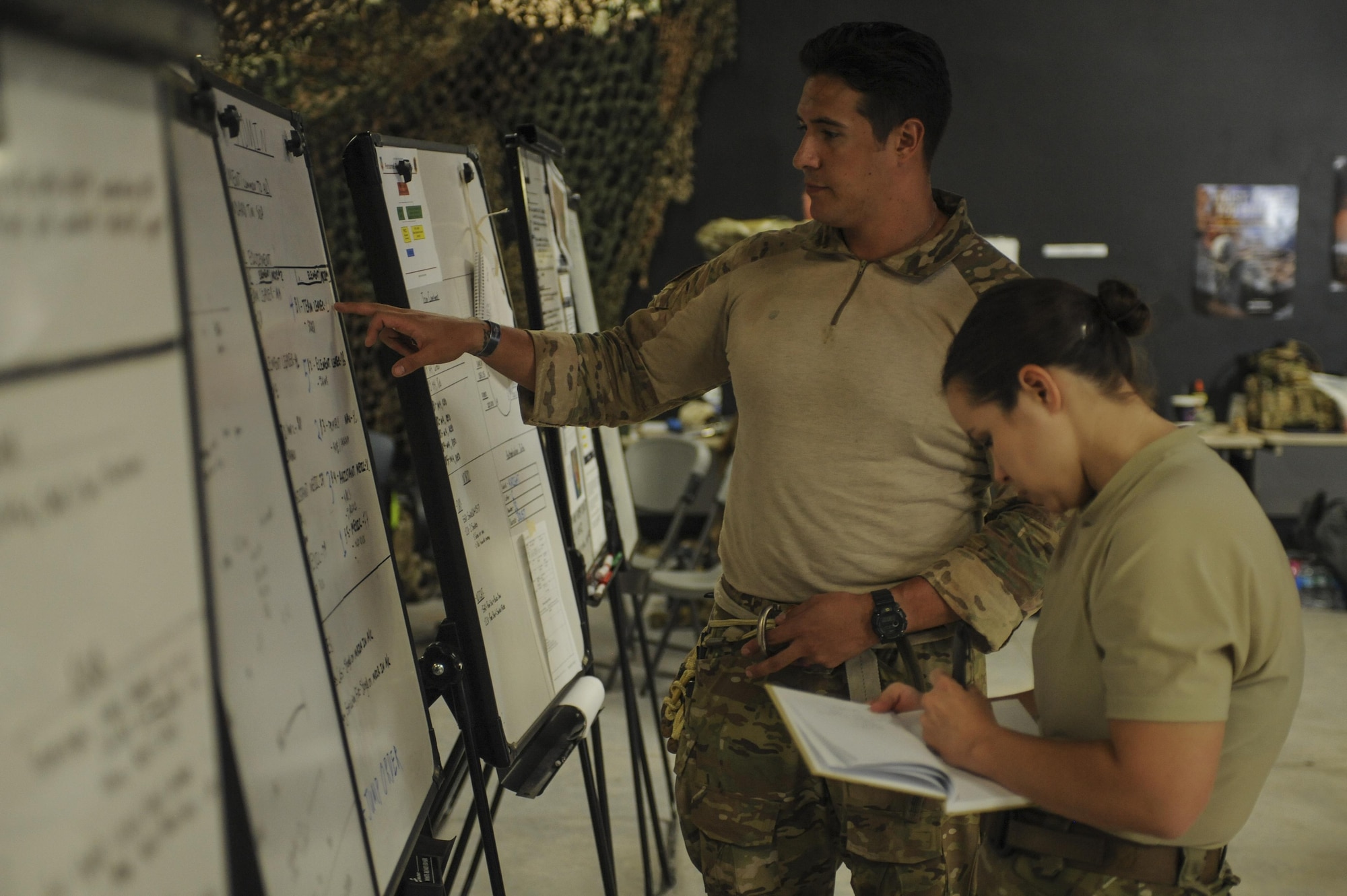A U.S. Air Force Guardian Angel formal training unit instructor and support personnel plan for a mission during Combat Leaders Course training in Florence, Ariz., Aug. 30, 2016. Guardian Angel is comprised of combat rescue officers, pararescuemen, survival, evasion, resistance, and escape specialists and special trained support personnel dedicated to one of the Air Force’s primary functions of personnel recovery and combat search and rescue. (U.S. Air Force photo by Airman 1st Class Mya M. Crosby)