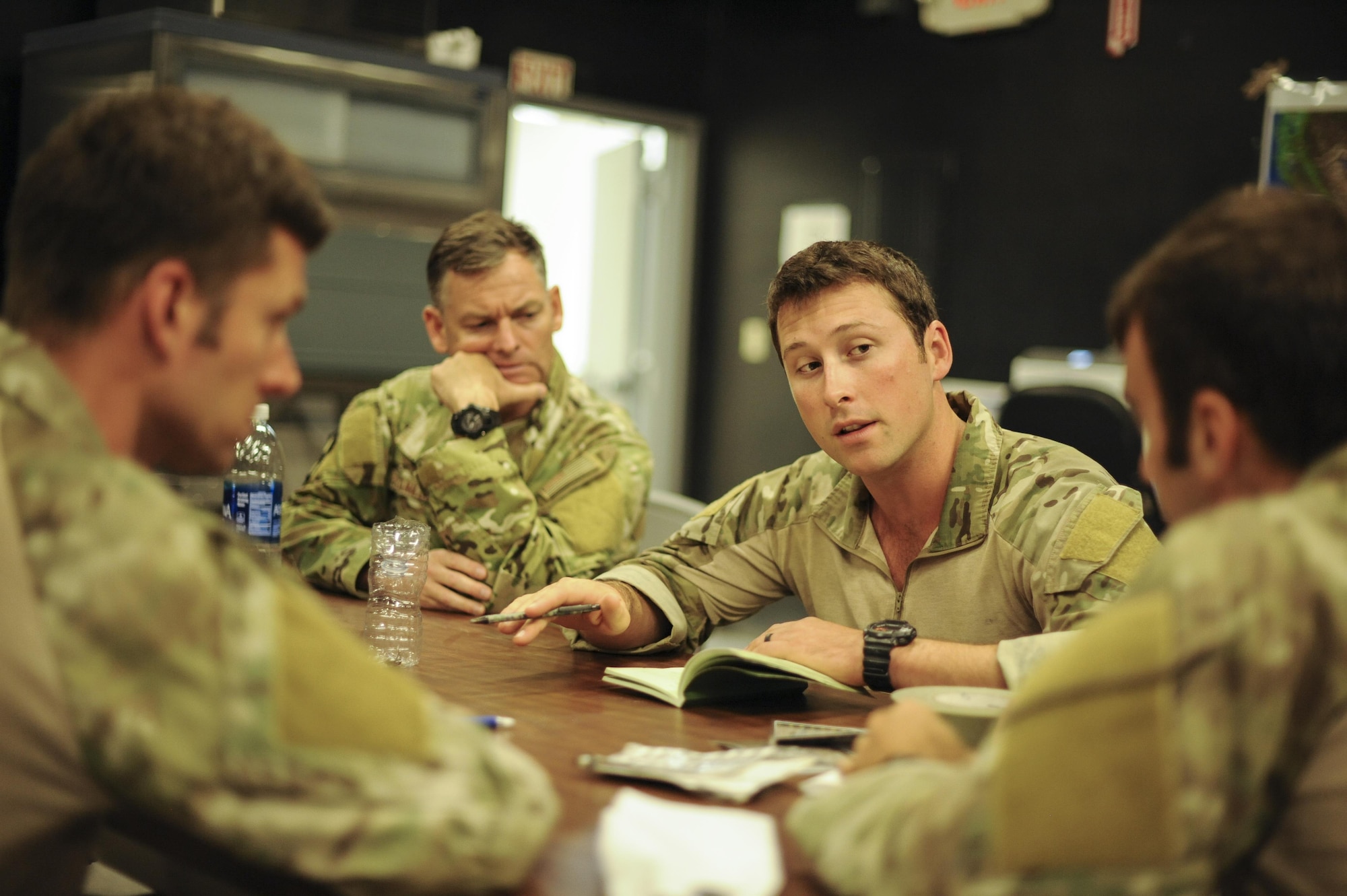 A U.S. Air Force Guardian Angel formal training unit instructor gives Combat Leader Course students feedback during training in Florence, Ariz., Aug. 30, 2016. The course included a jump mission with an overland movement, a mass casualty and a technical rescue scenario with the rotary wing exfiltration all within the climates of southern Arizona and California. (U.S. Air Force photo by Airman 1st Class Mya M. Crosby)