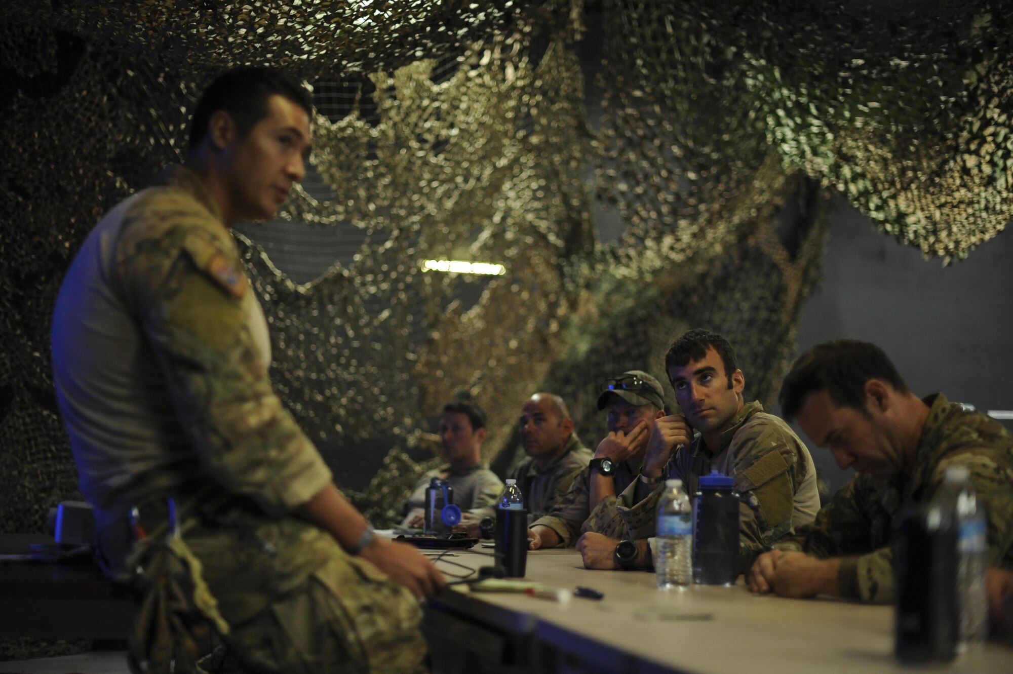 A U.S. Air Force Guardian Angel formal training unit instructor briefs pararescuemen during Combat Leaders Course training in Florence, Ariz., Aug. 30, 2016. Guardian Angel is comprised of combat rescue officers, pararescuemen, survival, evasion, resistance, and escape specialists and special trained support personnel dedicated to one of the Air Force’s primary functions of personnel recovery and combat search and rescue. (U.S. Air Force photo by Airman 1st Class Mya M. Crosby)