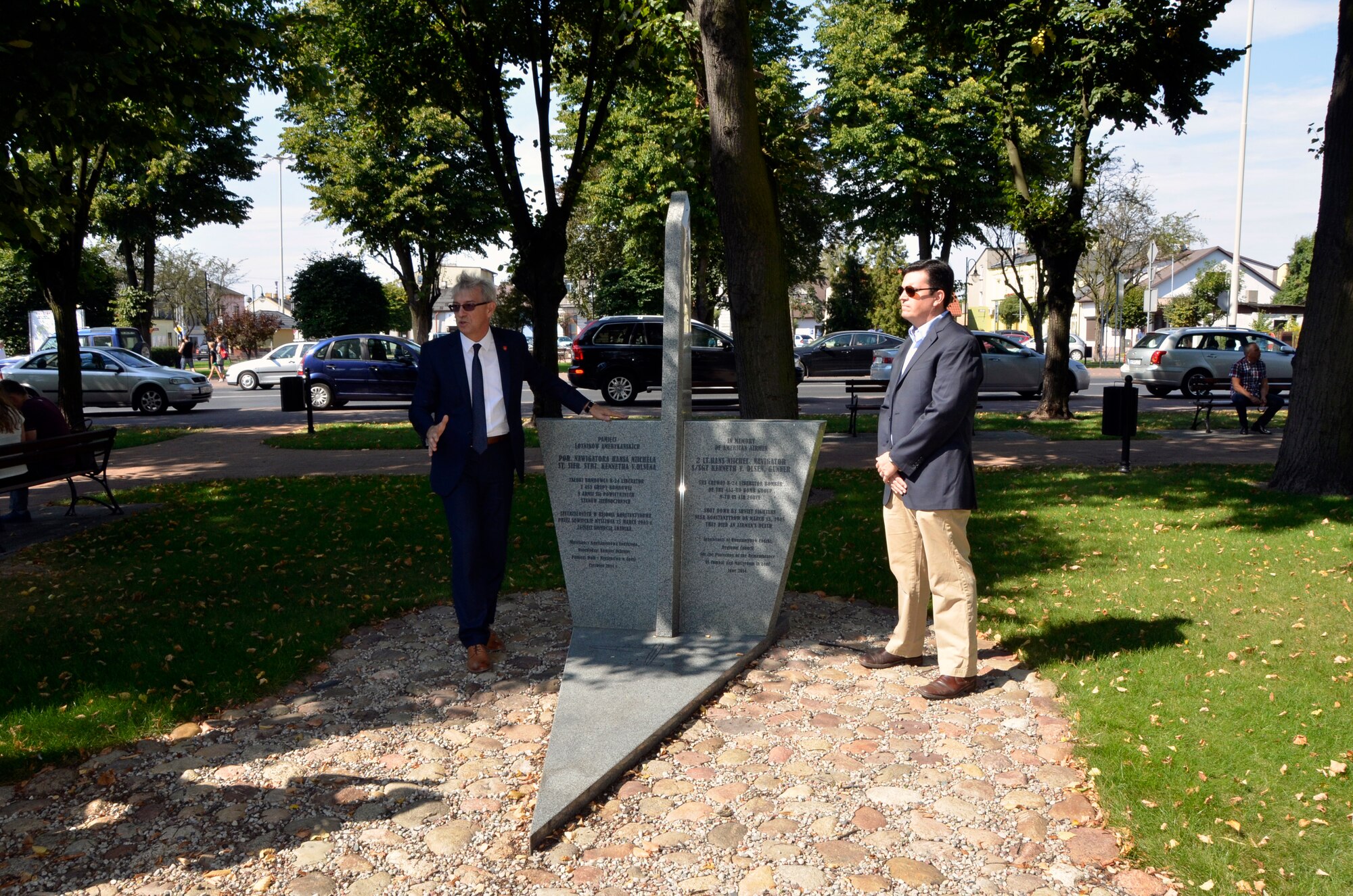 Konstantynow Lodzki, Poland -- Henryk Brzyszcz, left, mayor of Konstantynow Lodzki, tells the story of a WWII U.S. bomber crew that went down here March 15, 1945, killing two of the seven on board. Mayor Brzyszcz invited Lt. Col. Kristofer Padilla, 52nd Operations Group Detachment 1 commander, based out of Lask Air Base, Poland, and members of the South Dakota Air National Guard, 114th Fighter Wing to participate in a memorial service honoring the WWII U.S. bomber crew Sept. 4. (U.S. Air National Guard photo by Capt. Amy Rittberger/Released)