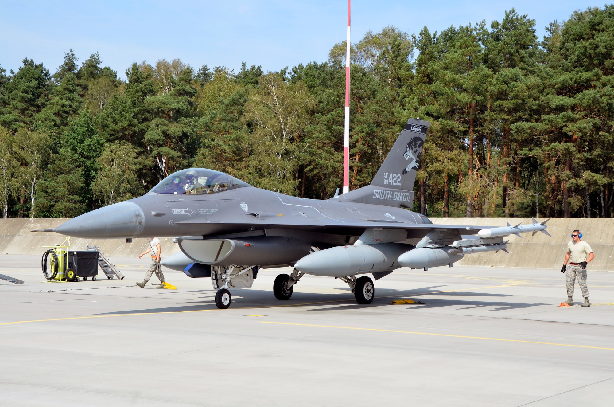 Lask Air Base, Poland -- An F-16 Fighting Falcon from the South Dakota Air National Guard, 114th Fighter Wing parks at Lask Air Base, Sept. 3. More than 100 members of the unit are deployed in support of Aviation Detachment 16-4, a bilateral training exercise between the U.S. and Polish forces. (U.S. Air National Guard photo by Capt. Amy Rittberger/Released)