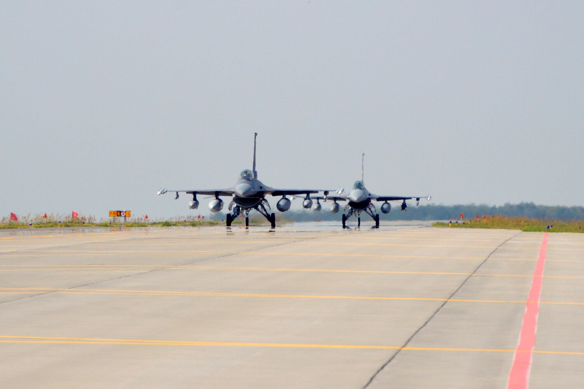 Two F-16 Fighting Falcons from the South Dakota Air National Guard, 114th Fighter Wing arrive at Lask Air Base, Sept. 3. More than 100 members of the unit are deployed in support of Aviation Detachment 16-4, a bilateral training exercise between the U.S. and Polish forces. (U.S. Air National Guard photo by Capt. Amy Rittberger/Released)