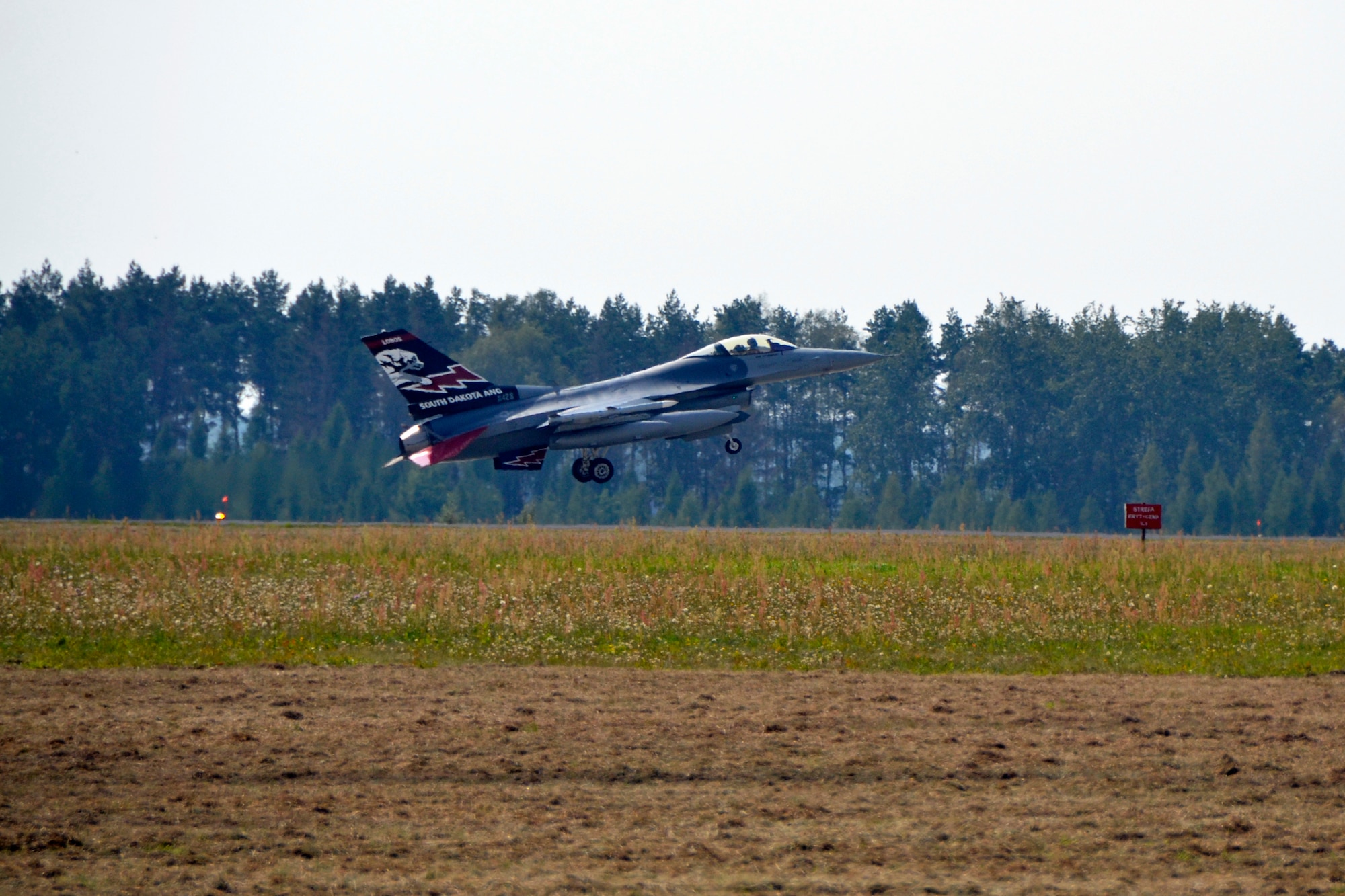 An F-16 Fighting Falcon from the South Dakota Air National Guard, 114th Fighter Wing lands at Lask Air Base, Sept. 3. More than 100 members of the unit are deployed in support of Aviation Detachment 16-4, a bilateral training exercise between the U.S. and Polish forces. (U.S. Air National Guard photo by Capt. Amy Rittberger/Released)