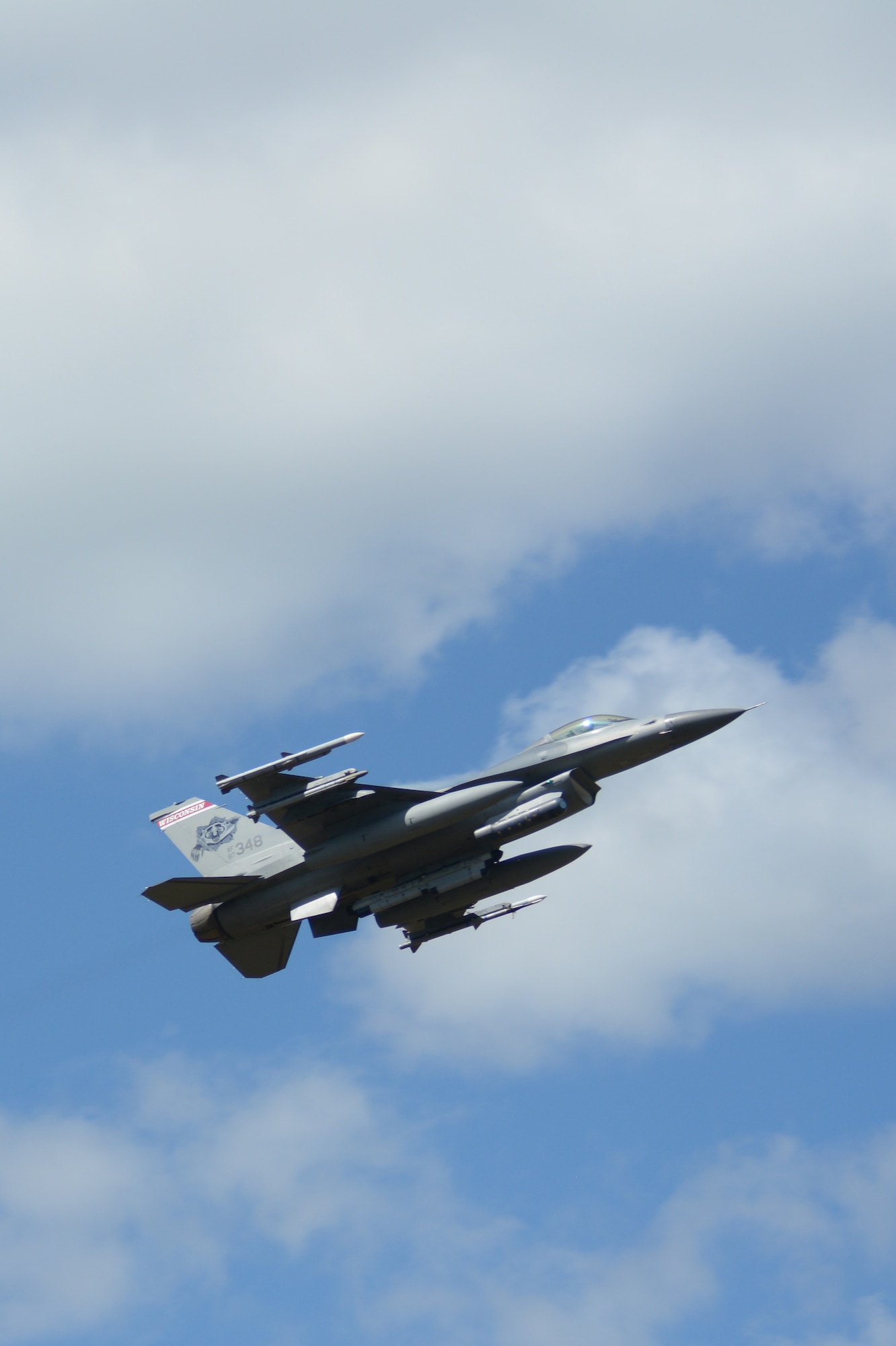 An F-16 Fighting Falcon flies past the tower at Hardwood Range, near Finley, Wis., during the 2016 Northern Lightning Exercise at Volk Field Air National Guard Base, Camp Douglas, Wis., Aug. 31, 2016. More than 1,000 service members and both fourth and fifth generation aircraft had the opportunity to train together during the two-week exercise. (U.S. Air National Guard photo by Staff Sgt. Andrea F. Rhode)