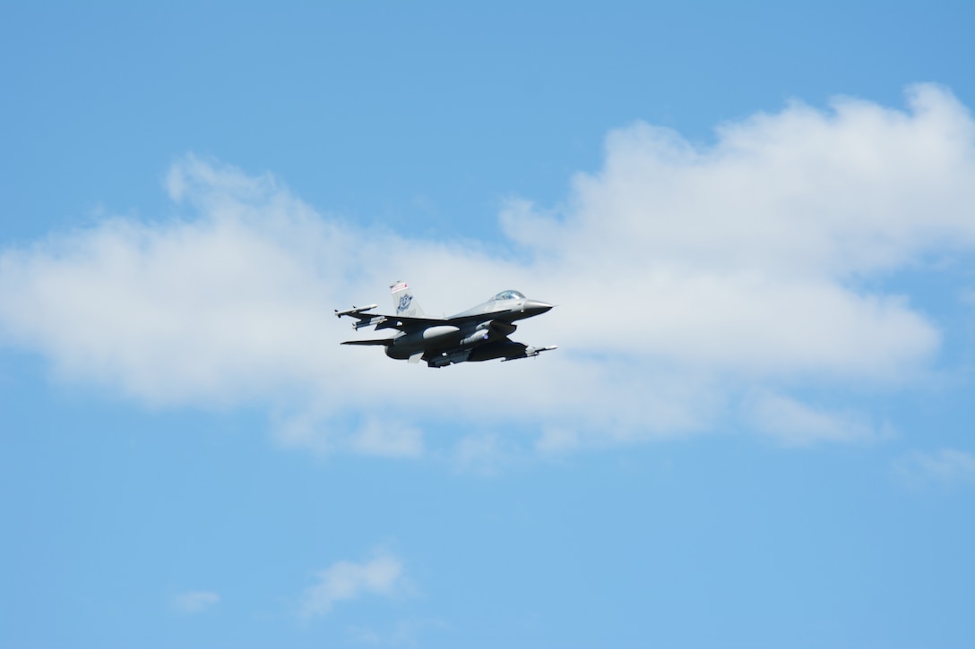 An F-16 Fighting Falcon flies past the tower at Hardwood Range, near Finley, Wis., during the 2016 Northern Lightning Exercise at Volk Field Air National Guard Base, Camp Douglas, Wis., Aug. 31, 2016. More than 1,000 service members and both fourth and fifth generation aircraft had the opportunity to train together during the two-week exercise. (U.S. Air National Guard photo by Staff Sgt. Andrea F. Rhode)