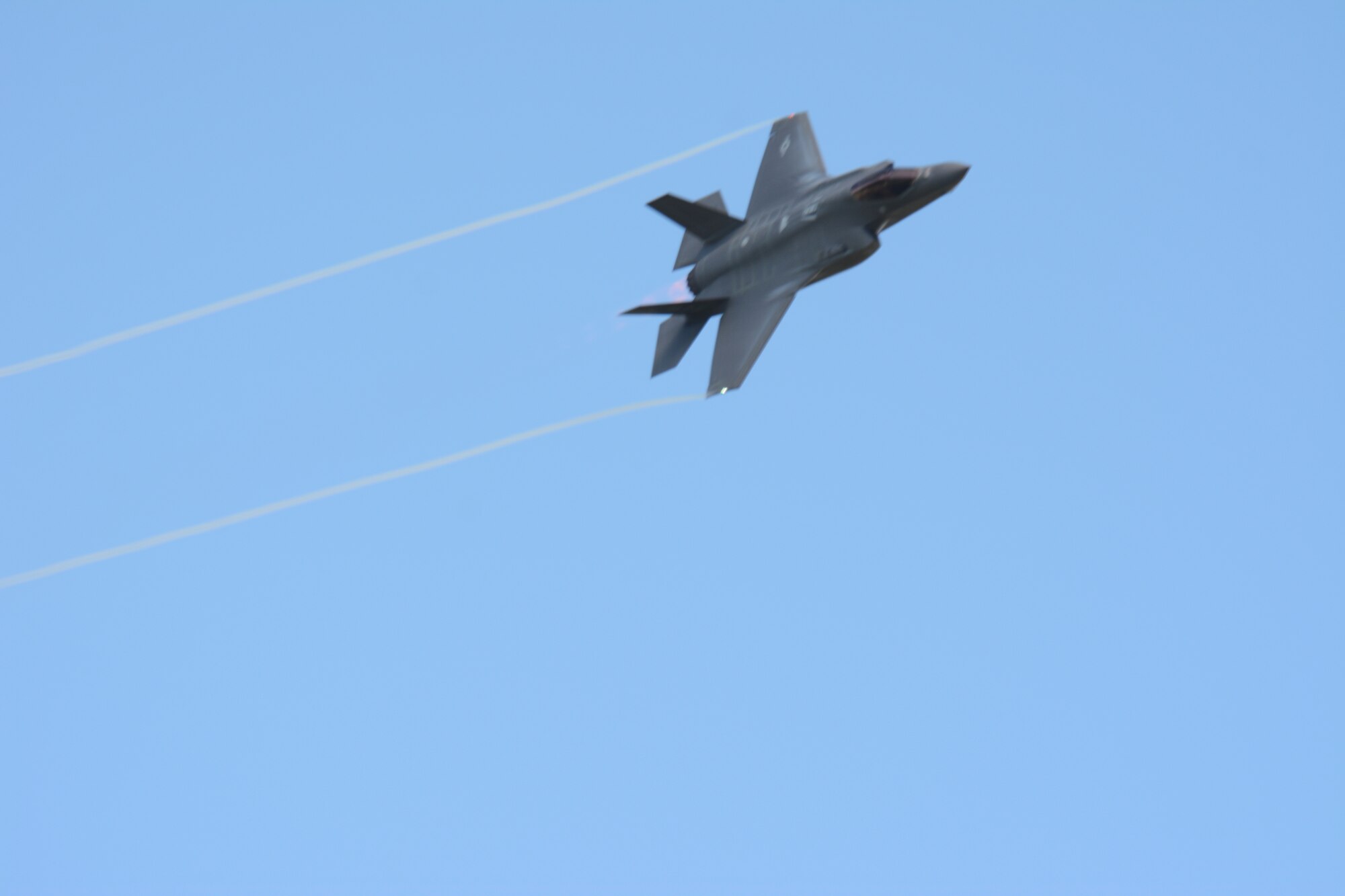 An F-35 Lightning II flies past the tower at Hardwood Range, near Finley, Wis., during the 2016 Northern Lightning Exercise at Volk Field Air National Guard Base, Camp Douglas, Wis., Aug. 31, 2016. More than 1,000 service members and both fourth and fifth generation aircraft had the opportunity to train together during the two-week exercise. (U.S. Air National Guard photo by Staff Sgt. Andrea F. Rhode)