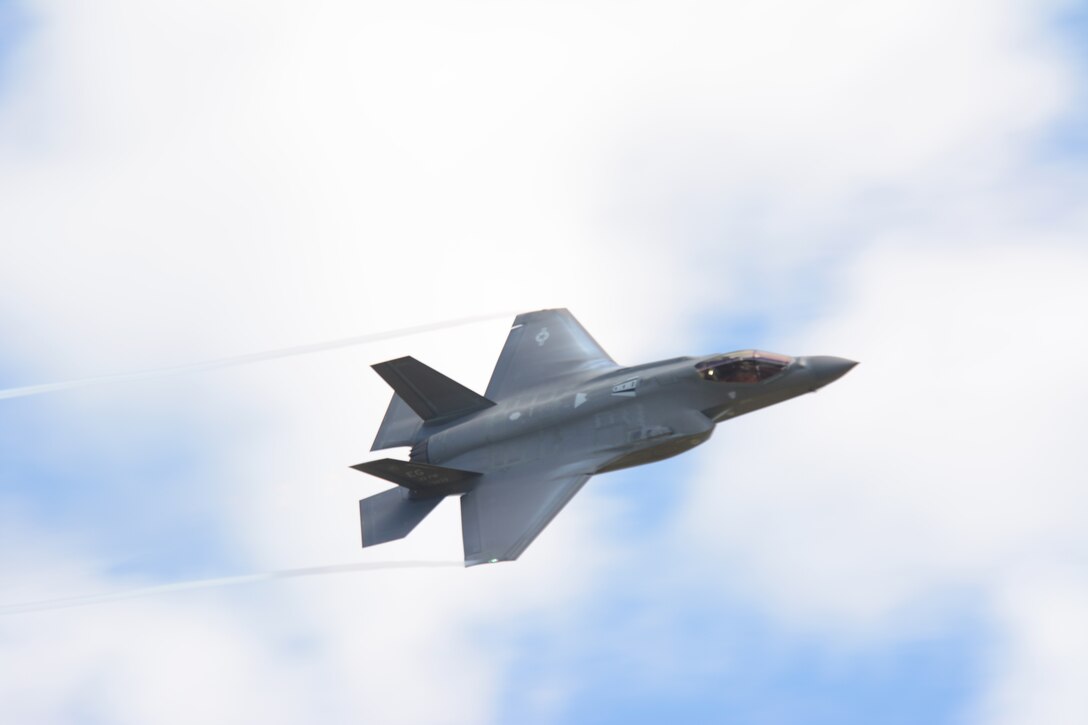 An F-35 Lightning II flies past the tower at Hardwood Range, near Finley, Wis., during the 2016 Northern Lightning Exercise at Volk Field Air National Guard Base, Camp Douglas, Wis., Aug. 31, 2016. More than 1,000 service members and both fourth and fifth generation aircraft had the opportunity to train together during the two-week exercise. (U.S. Air National Guard photo by Staff Sgt. Andrea F. Rhode)
