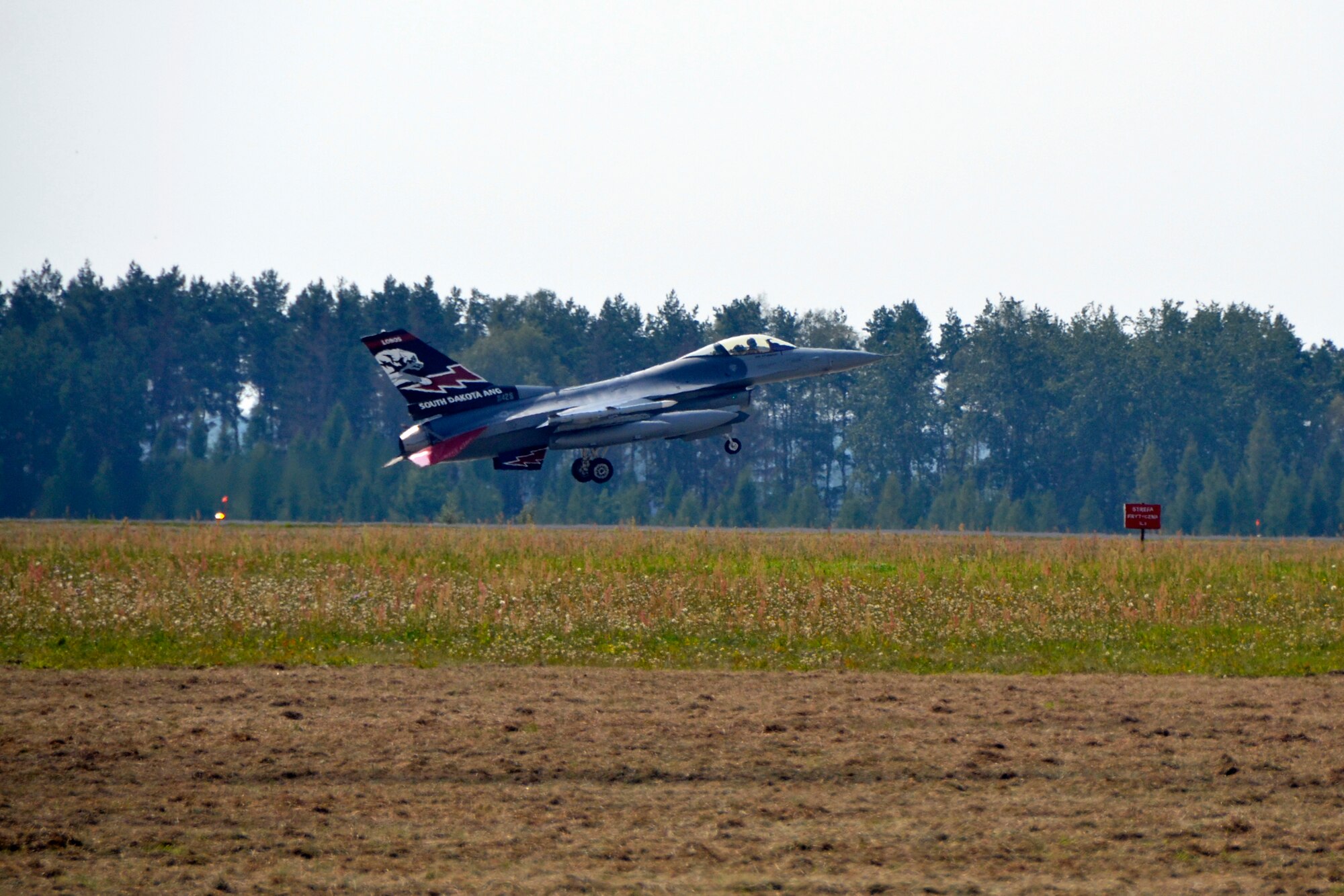 An F-16 Fighting Falcon from the South Dakota Air National Guard, 114th Fighter Wing lands at Lask Air Base, Sept. 3. More than 100 members of the unit are deployed in support of Aviation Detachment 16-4, a bilateral training exercise between the U.S. and Polish forces. (U.S. Air National Guard photo by Capt. Amy Rittberger/Released)