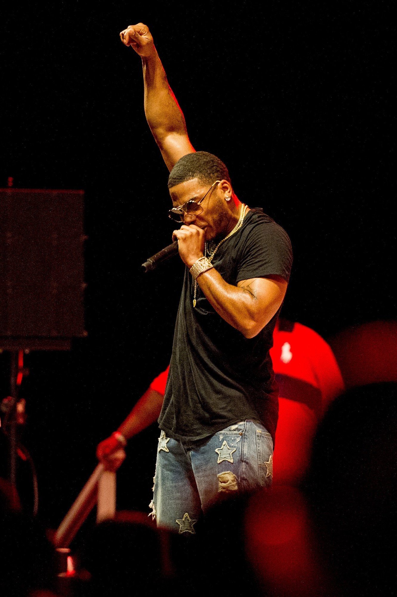 Nelly performs a song for Team Osan members at Osan Air Base, Republic of Korea, Sept. 3, 2016. Team Osan members was able to meet Nelly after the performance during a meet and greet to get photos and signatures. (U.S. Air Force photo by Staff Sgt. Jonathan Steffen)                                                                                           