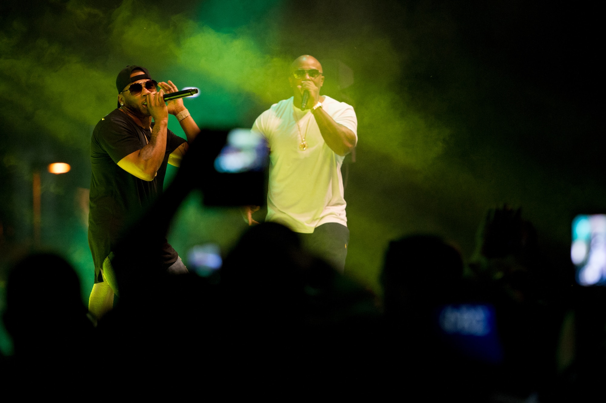 Nelly (left) performs at Osan Air Base, Republic of Korea, Sept. 3, 2016. The concert was sponsored by Armed Forces Entertainment to provide entertainment to the base. (U.S. Air Force photo by Staff Sgt. Jonathan Steffen)               