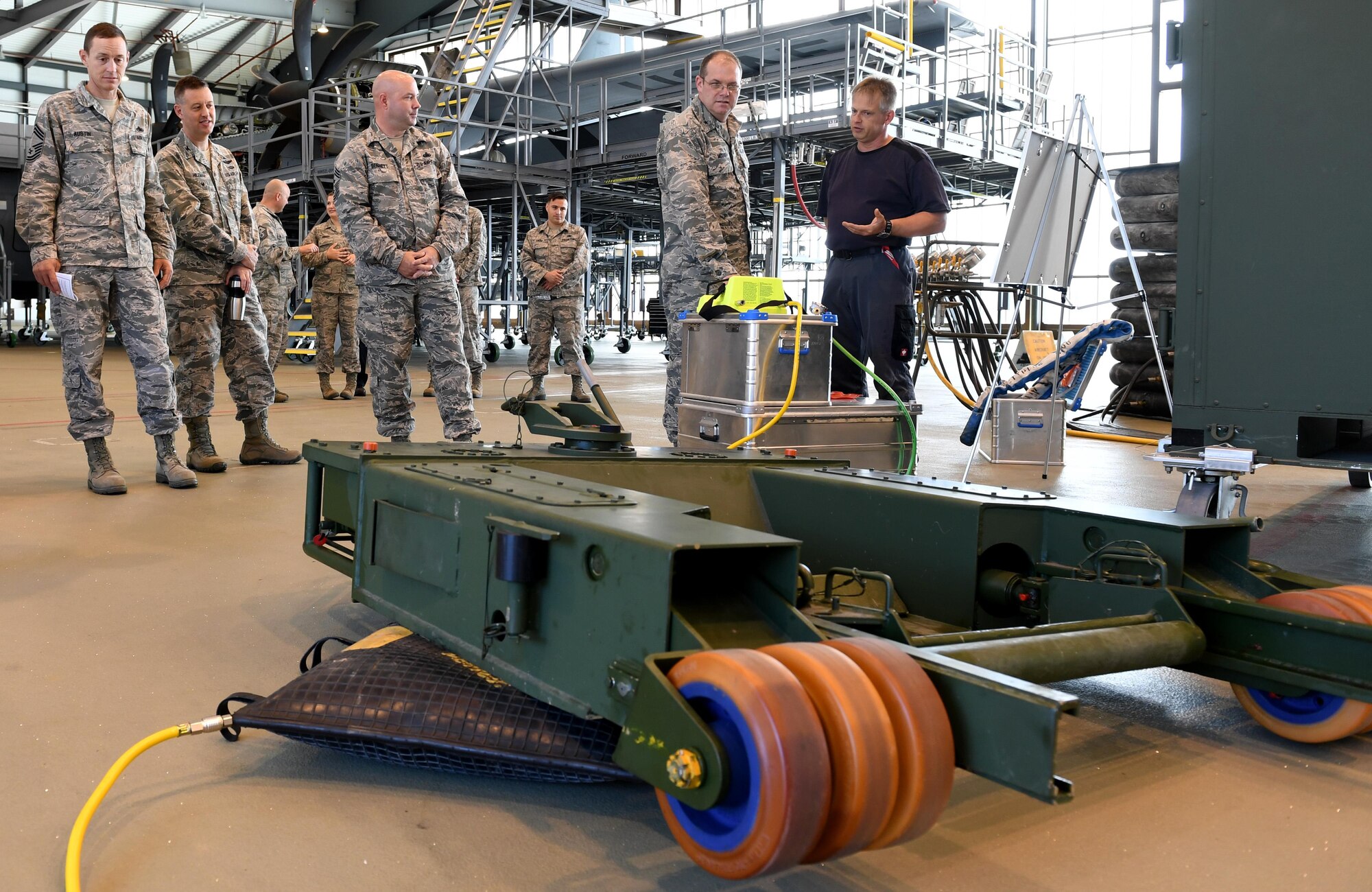 Tino Weichel, 86th Maintenance Squadron aero repair aircraft mechanic describes capabilities of the 86th Maintenance Group to Brig. Gen. Richard G. Moore, Jr., 86th Airlift Wing commander, during a demonstration Aug. 31, 2016 at Ramstein Air Base, Germany. The 86th MXG maintains U.S. Air Forces in Europe's only assigned distinguished visitor airlift and 24/7 aeromedical evacuation operations. (U.S. Air Force photo/Senior Airman Tryphena Mayhugh)