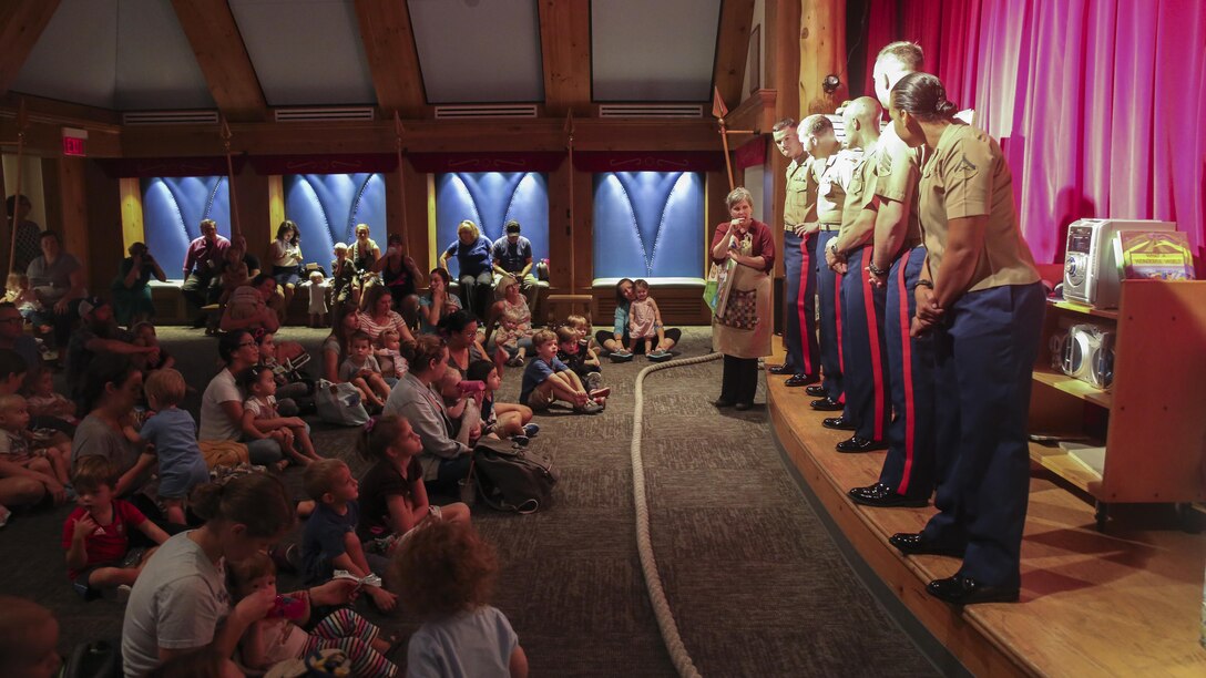 Marines with Marine Light Attack Helicopter Squadron 167 based out of New River, N.C., speak to children at the Nashville Public Library in Nashville, Tenn., Sept. 7, 2016. Marine Week provides a chance for the Marine Corps to visit a city that normally doesn’t have the opportunity to interact with Marines on a regular basis.