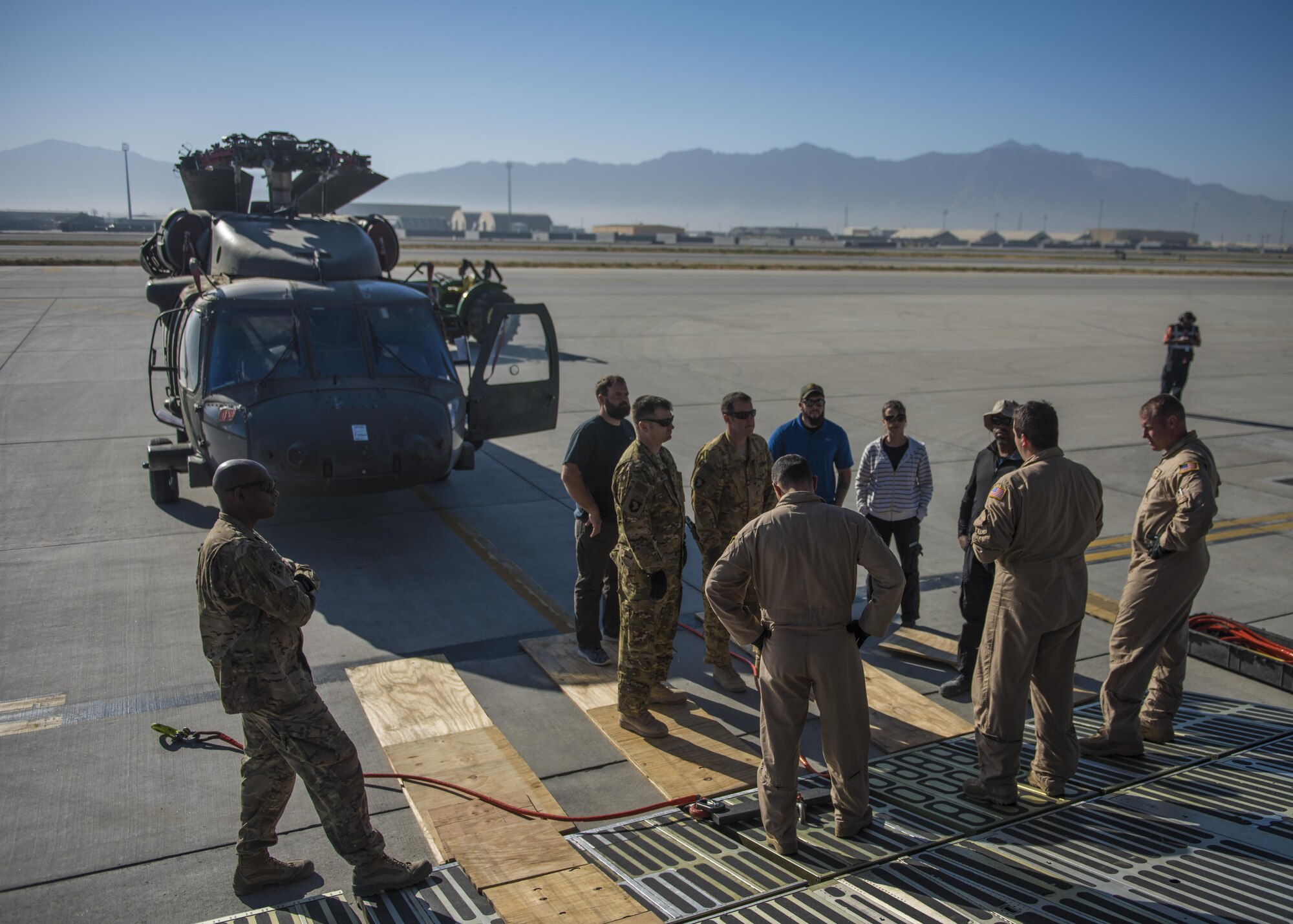 Senior Airman Maxwell Lucchesi, 436th Airlift Wing aircraft loadmaster, gives a mission and safety brief to other aircrew members, Bagram Airfield, Afghanistan, Sept. 8, 2016. Lucchesi was part of an aircrew team from Dover Air Force Base, who traveled to Bagram to help pack and transport Sikorsky UH-60 Blackhawks back to home stations. (U.S. Air Force photo by Senior Airman Justyn M. Freeman)