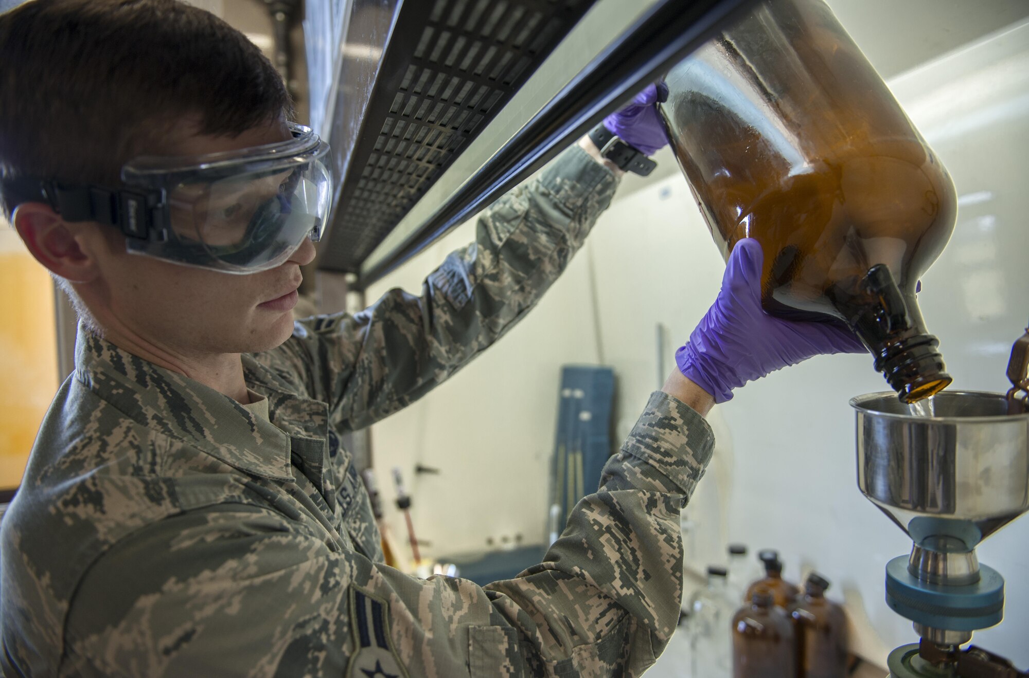 Airman 1st Class Chandler Adams, 31st Logistics Readiness Squadron fuels laboratory technician, tests fuel at Aviano Air Base, Italy, Sept. 7, 2016. The 31st LRS fuels laboratory Airmen maintain the bulk storage facility where millions of gallons of fuel are stored. (U.S. Air Force photo by Airman 1st Class Cory W. Bush/Released)